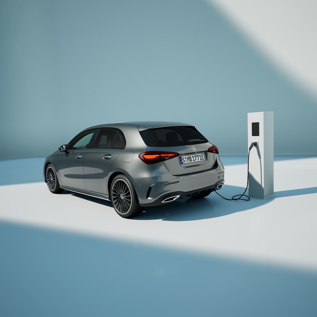 View of a Mercedes-Benz A 250 e with EQ hybrid technology standing at a charging station.