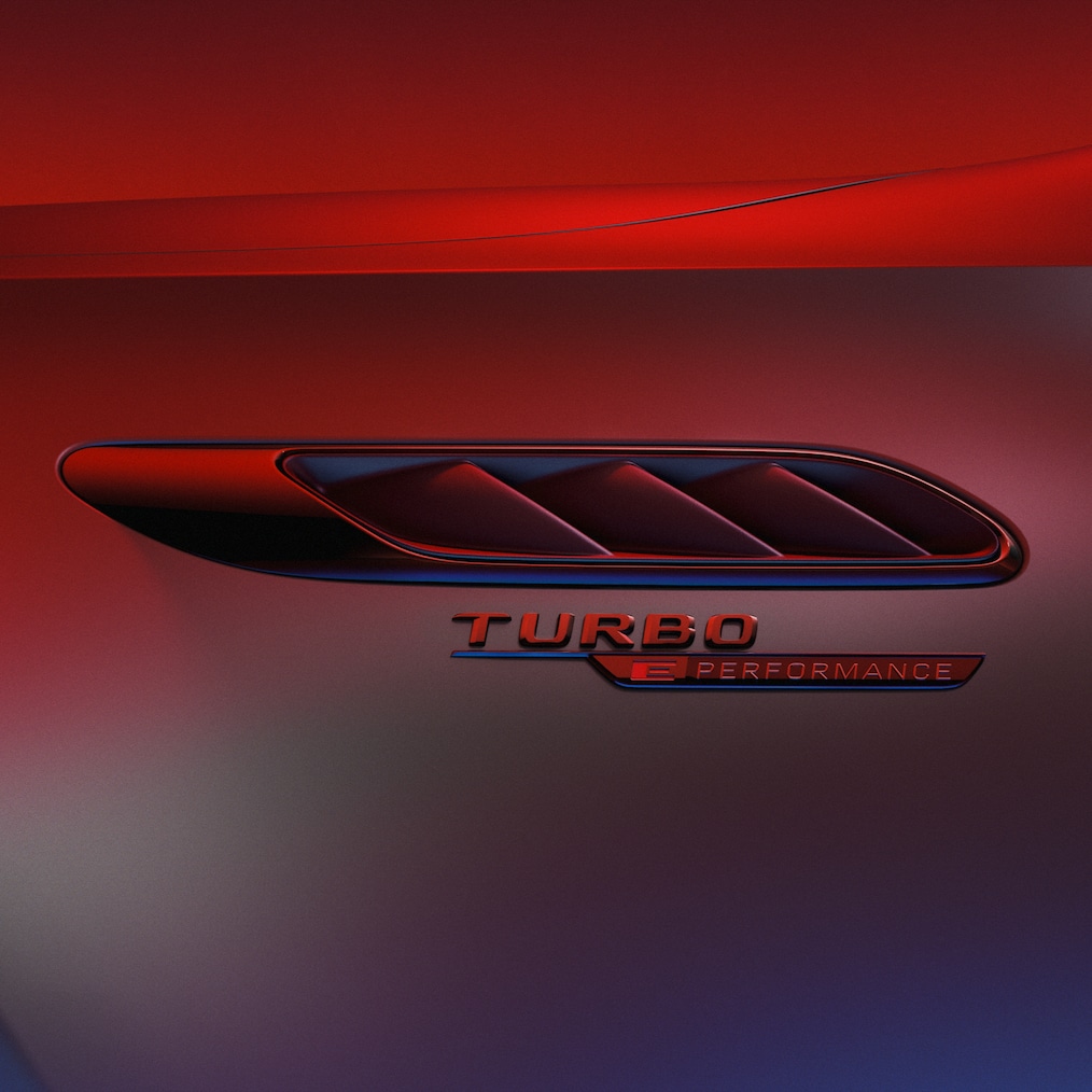 TURBO E PERFORMANCE badge on the front fender, illuminated by red light.