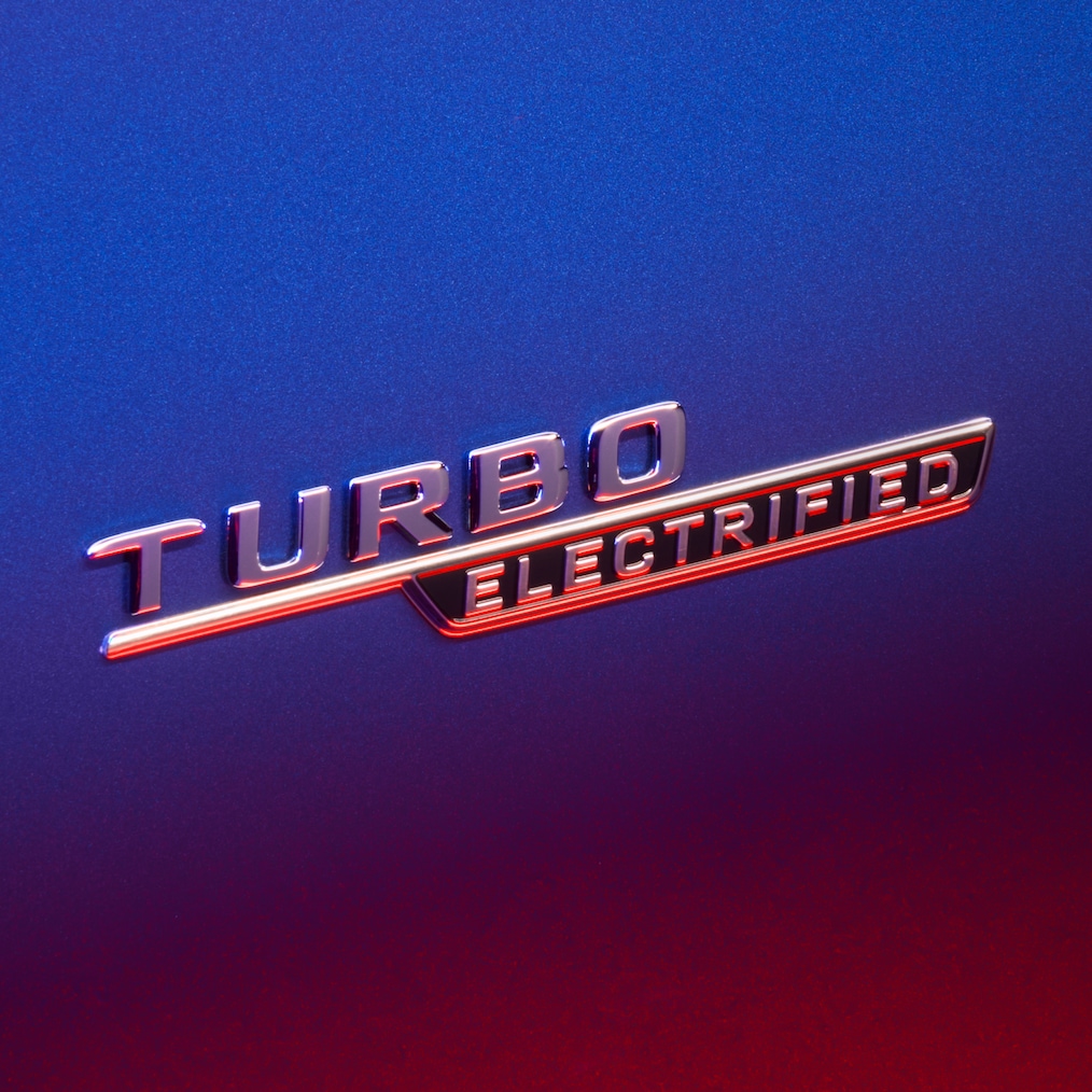 TURBO E PERFORMANCE badge on the front fender, illuminated by red light.