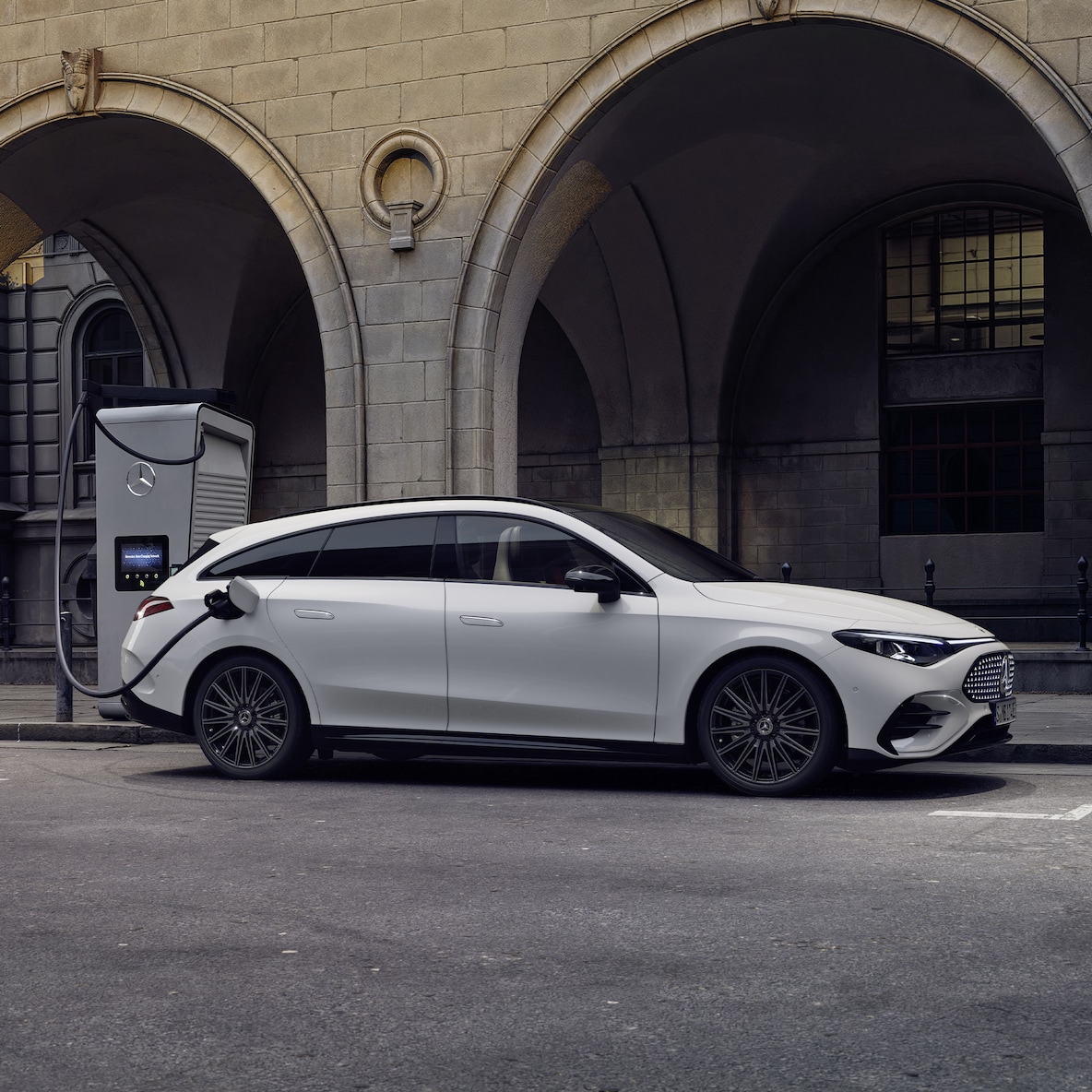 The electric CLA Shooting Brake with EQ Technology at a charging station.