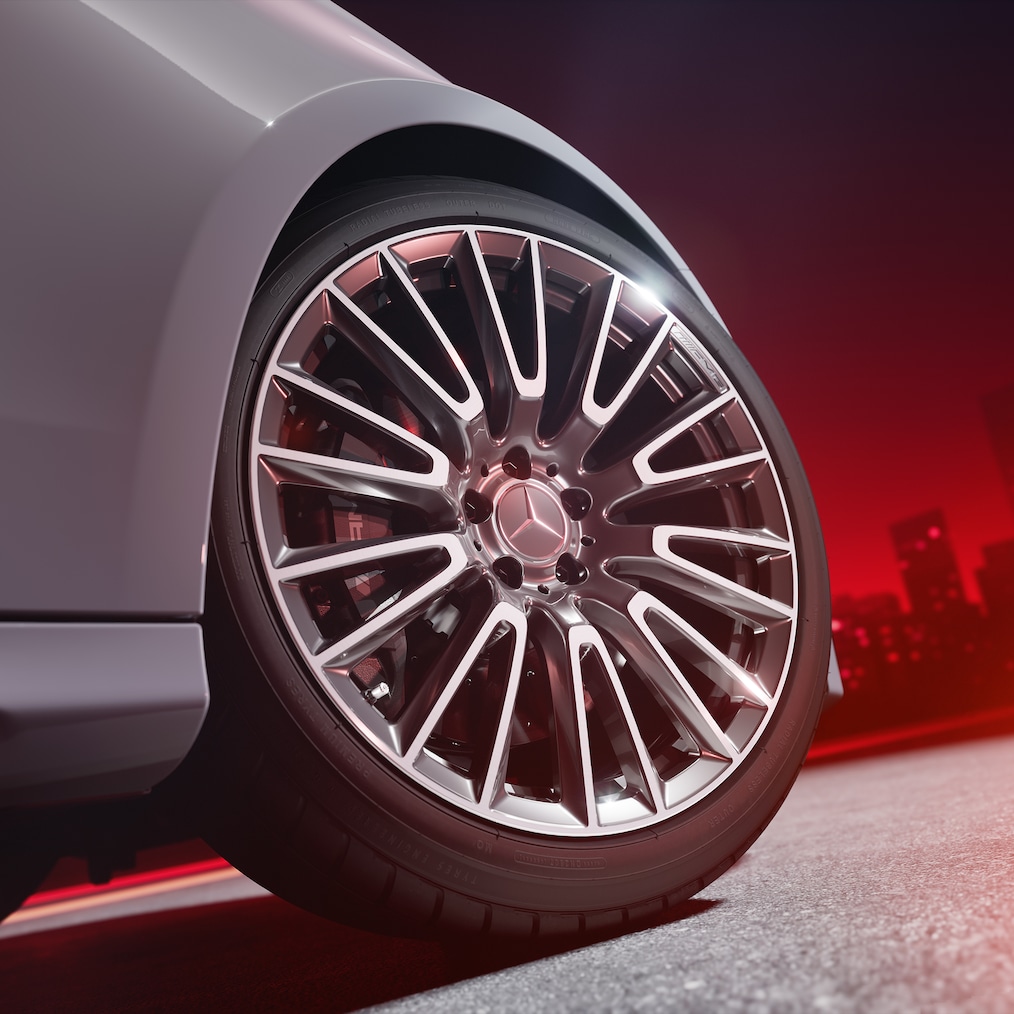 Close-up of an AMG forged wheel with AMG high-performance composite brake system with brake callipers painted in red.