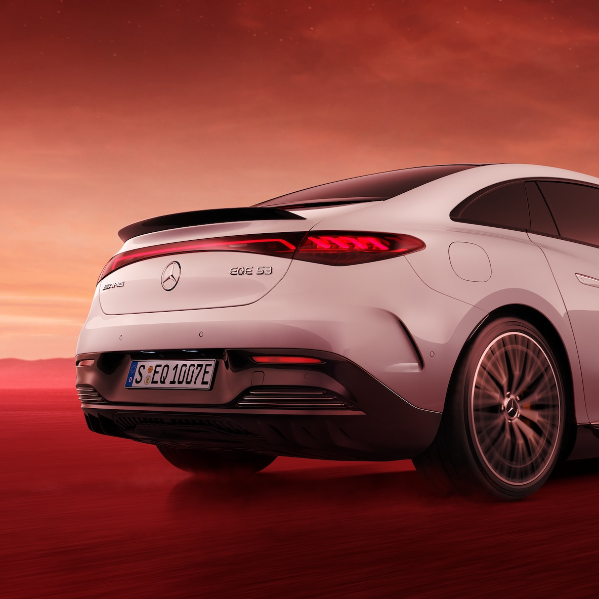 Rear view of a Mercedes-AMG EQE 53 4MATIC+ with close-up on tailgate and spoiler, seen from below.