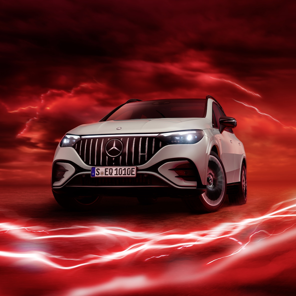 Mercedes-AMG EQE 53 4MATIC+ in the front view against a red background.