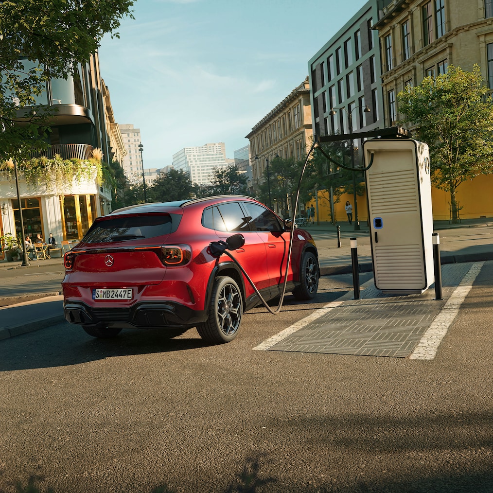 The all-new electric Mercedes-Benz GLA parked at an electric charging station. 