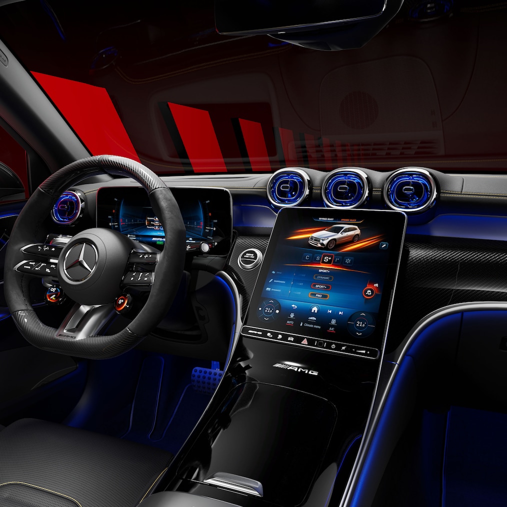 View from the passenger seat towards the dashboard and center console of a Mercedes-AMG GLC SUV.