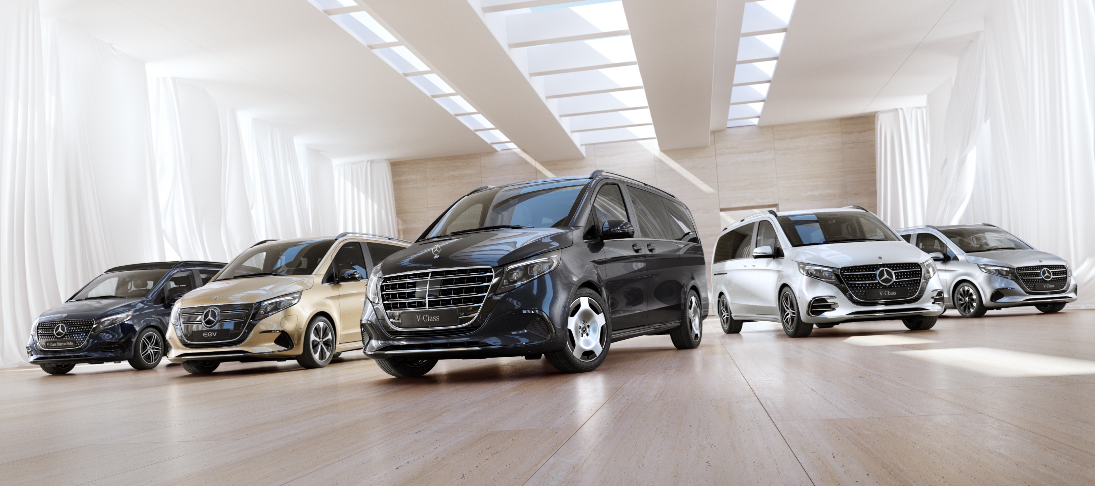 EQV, V-Class and V-Class Marco Polo | Mercedes-Benz The EQV, V-Class and V-Class Marco Polo from Mercedes-Benz on display in a room shrouded with curtains.
