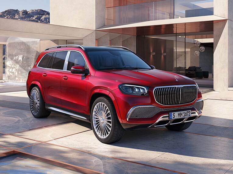 Side front view of the Mercedes-Maybach GLS in front of a modern house