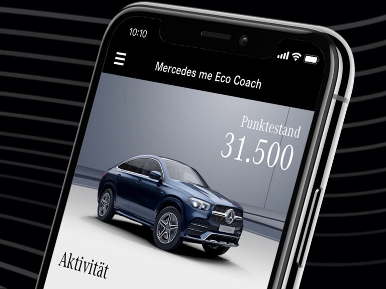 The Mercedes me Eco Coach App open on a smartphone, and the score achieved through a particularly environmentally friendly driving style displayed.