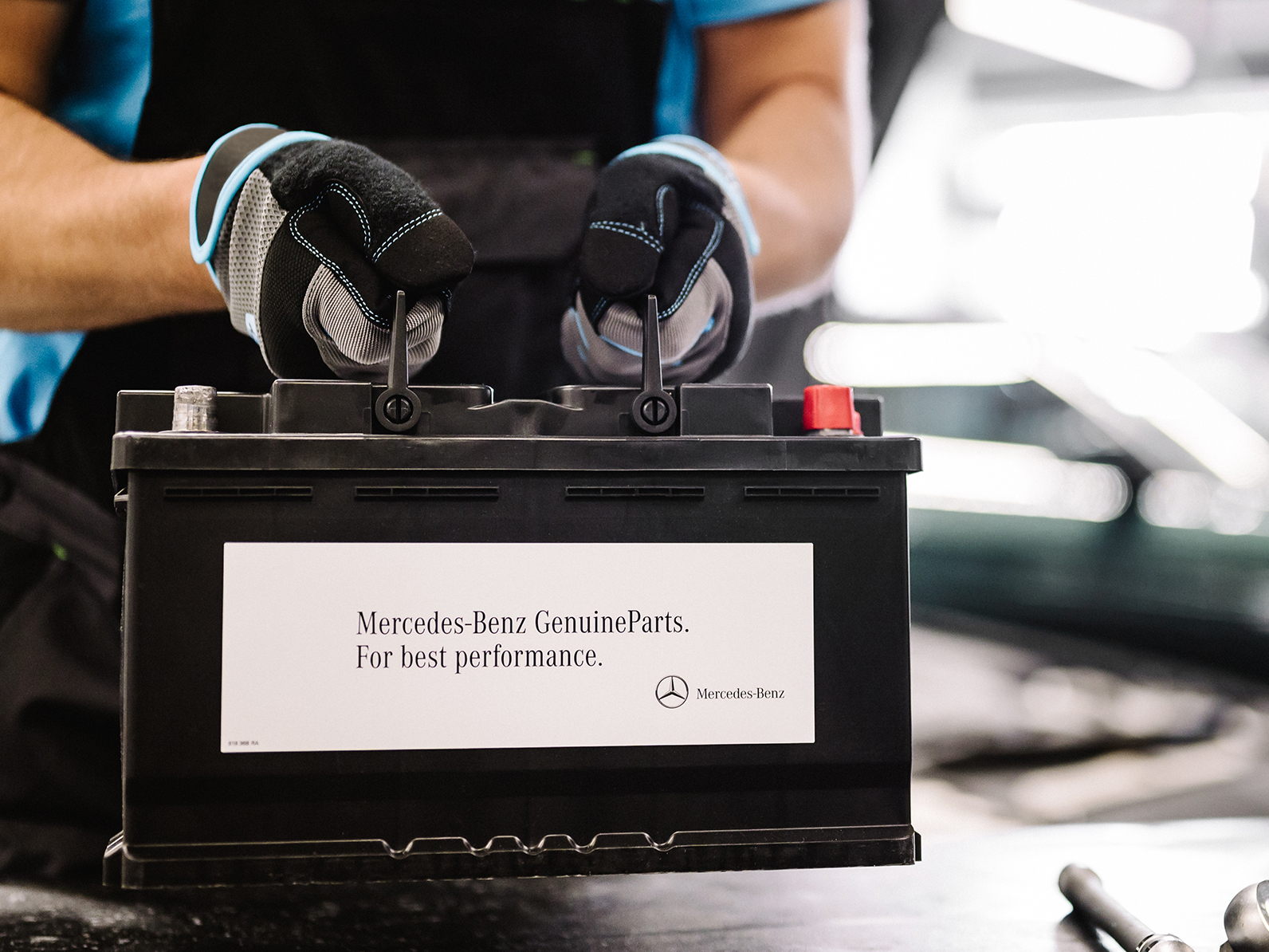 Mercedes-Benz genuine on-board power supply batteries A Mercedes-Benz technician checks the vehicle's electrical system battery.