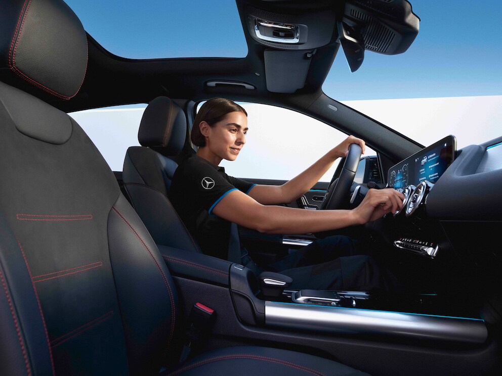 A Mercedes-Benz technician cleaning the air conditioning system.