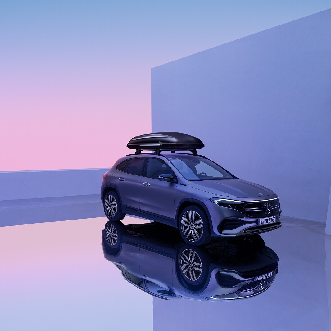 The Mercedes-Benz EQA is in a showroom with a roof luggage rack.