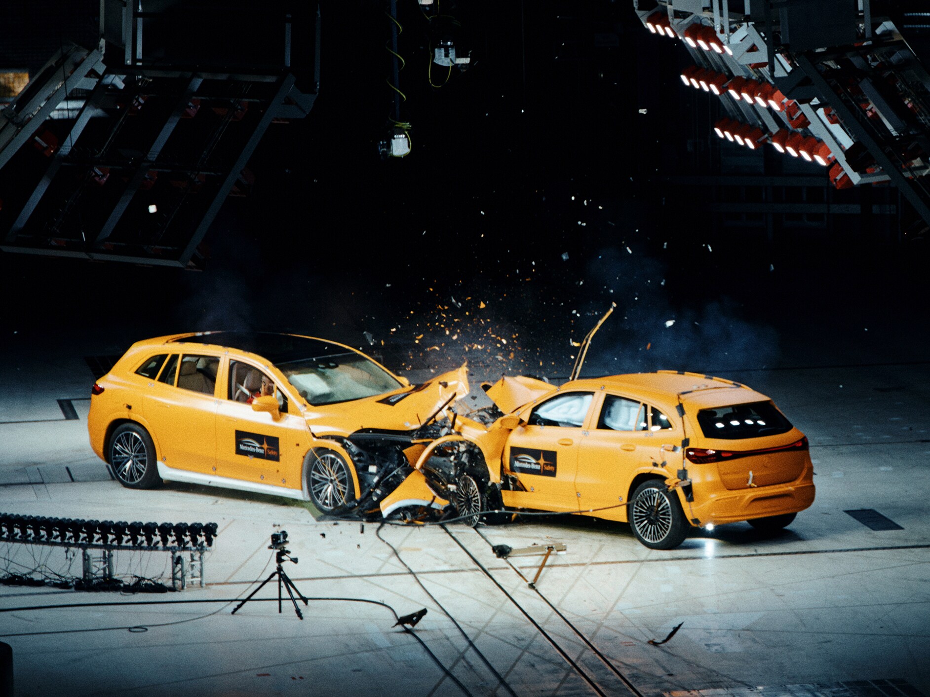 Frontal crash between two Mercedes-Benz cars captured by crash test cameras.