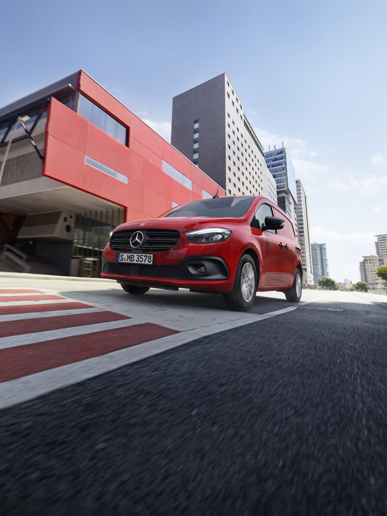 The Mercedes-Benz Citan Panel Van is driving on the street. 