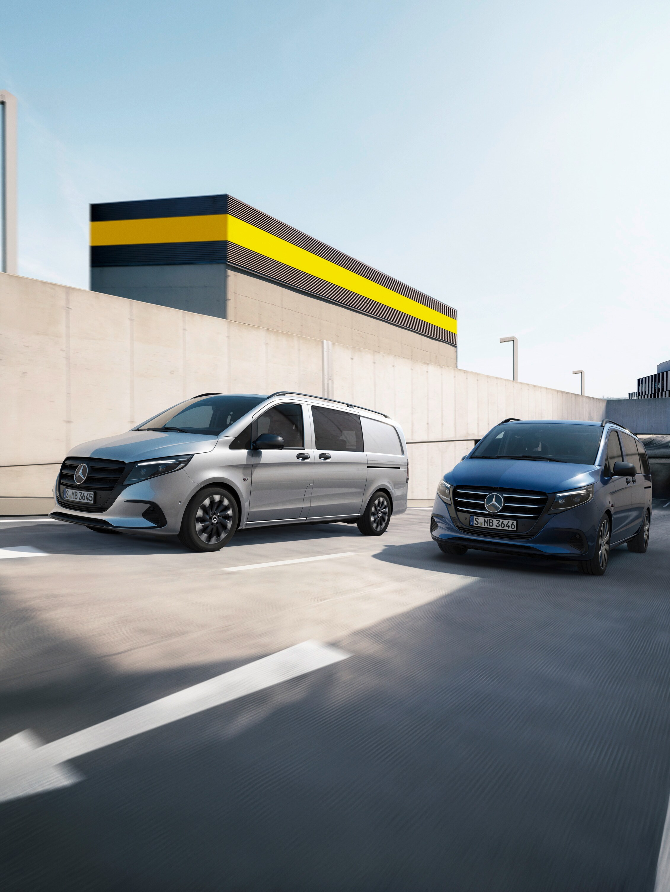 Two Mercedes-Benz vans (silver and blue) in a car park with a "Platinum 2024 Commercial Van Safety" badge.