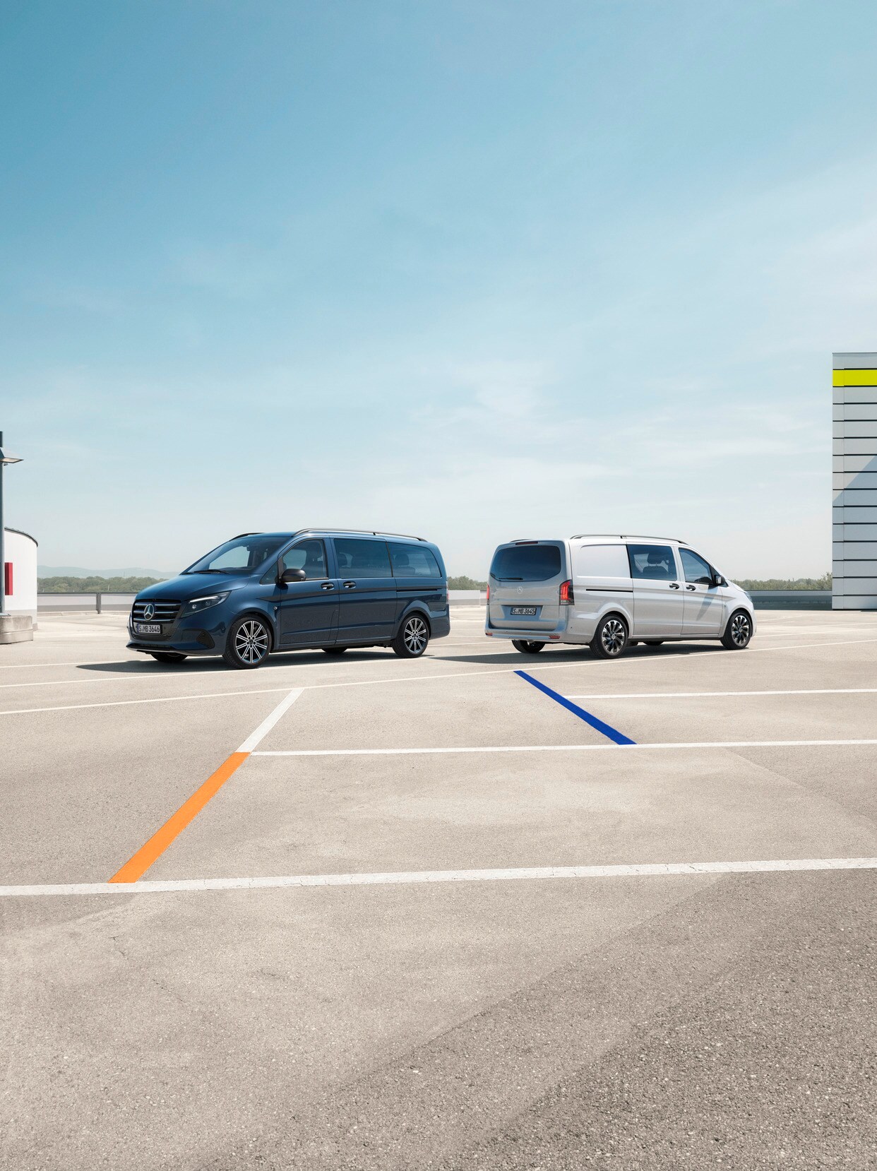 The Vito Tourer and Vito Mixto standing in a parking lot.