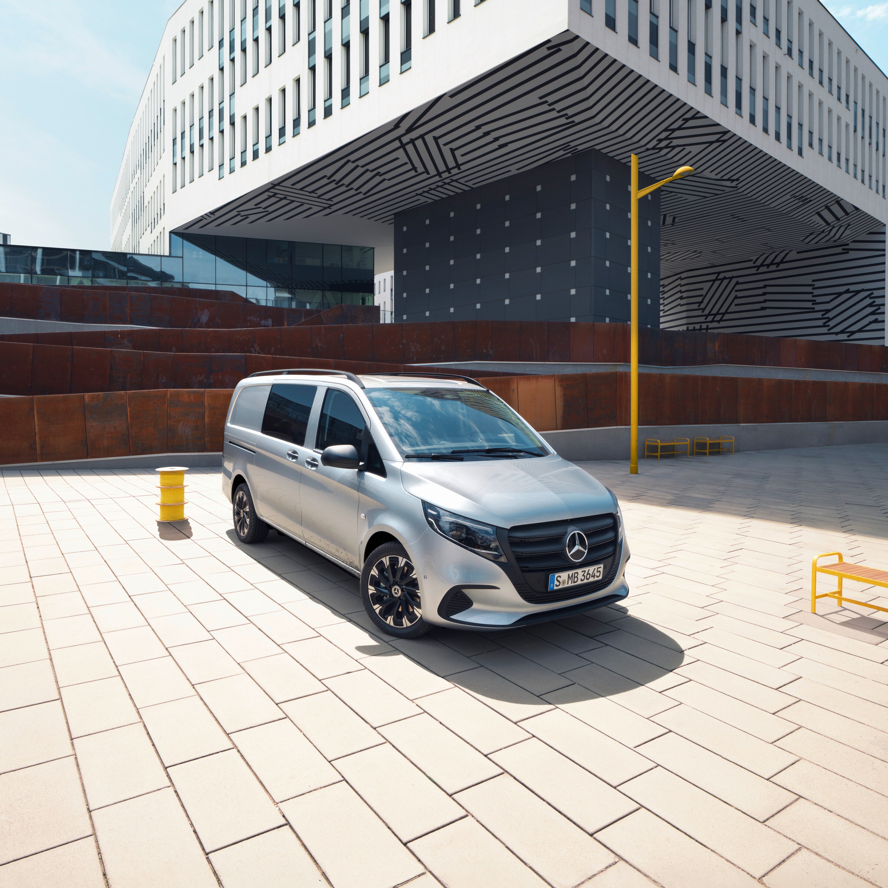 The Vito Crew in front of a business building.