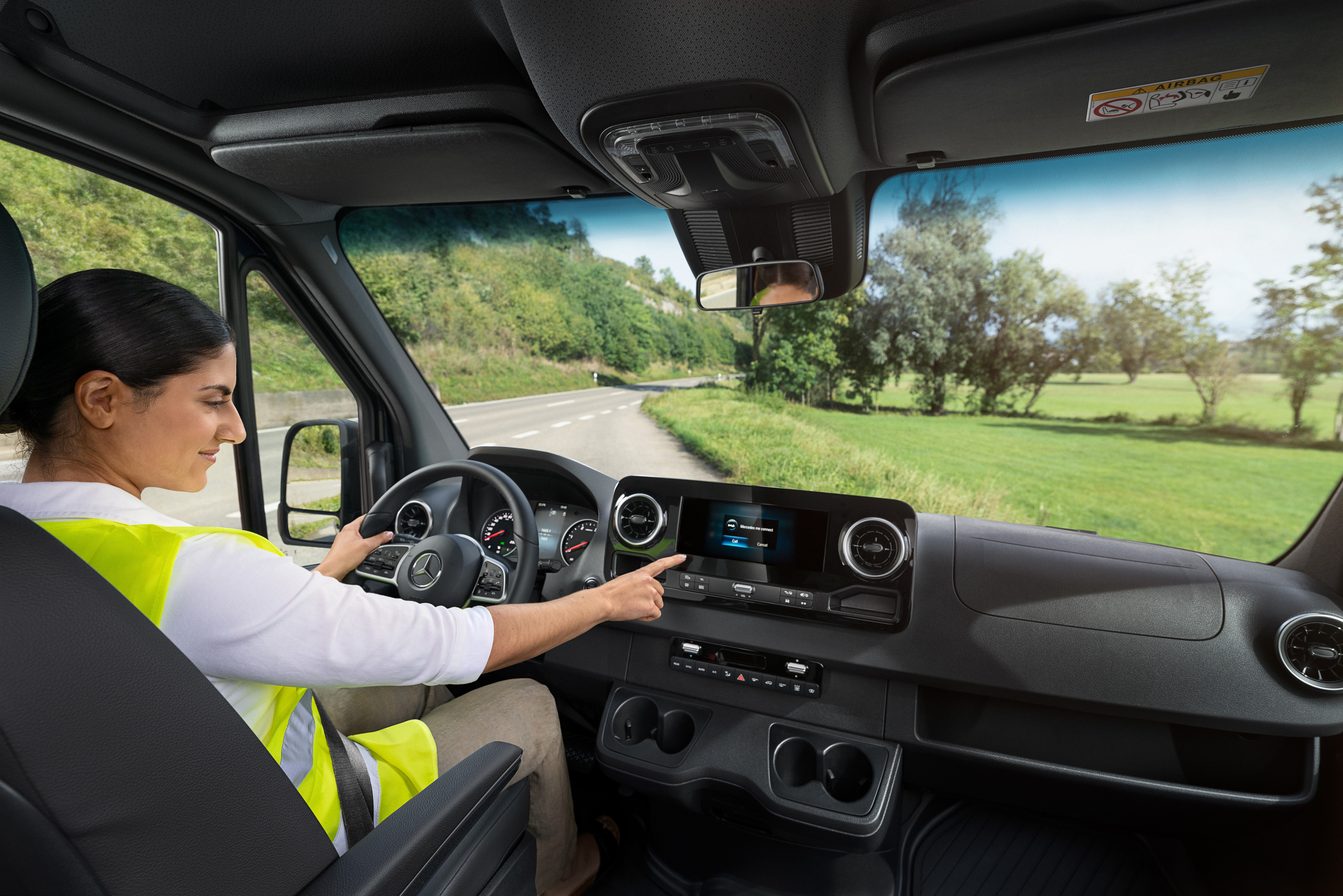 Mercedes Benz | Convenience | Mobilovan Driver checks the on-board display in her Mercedes-Benz van.