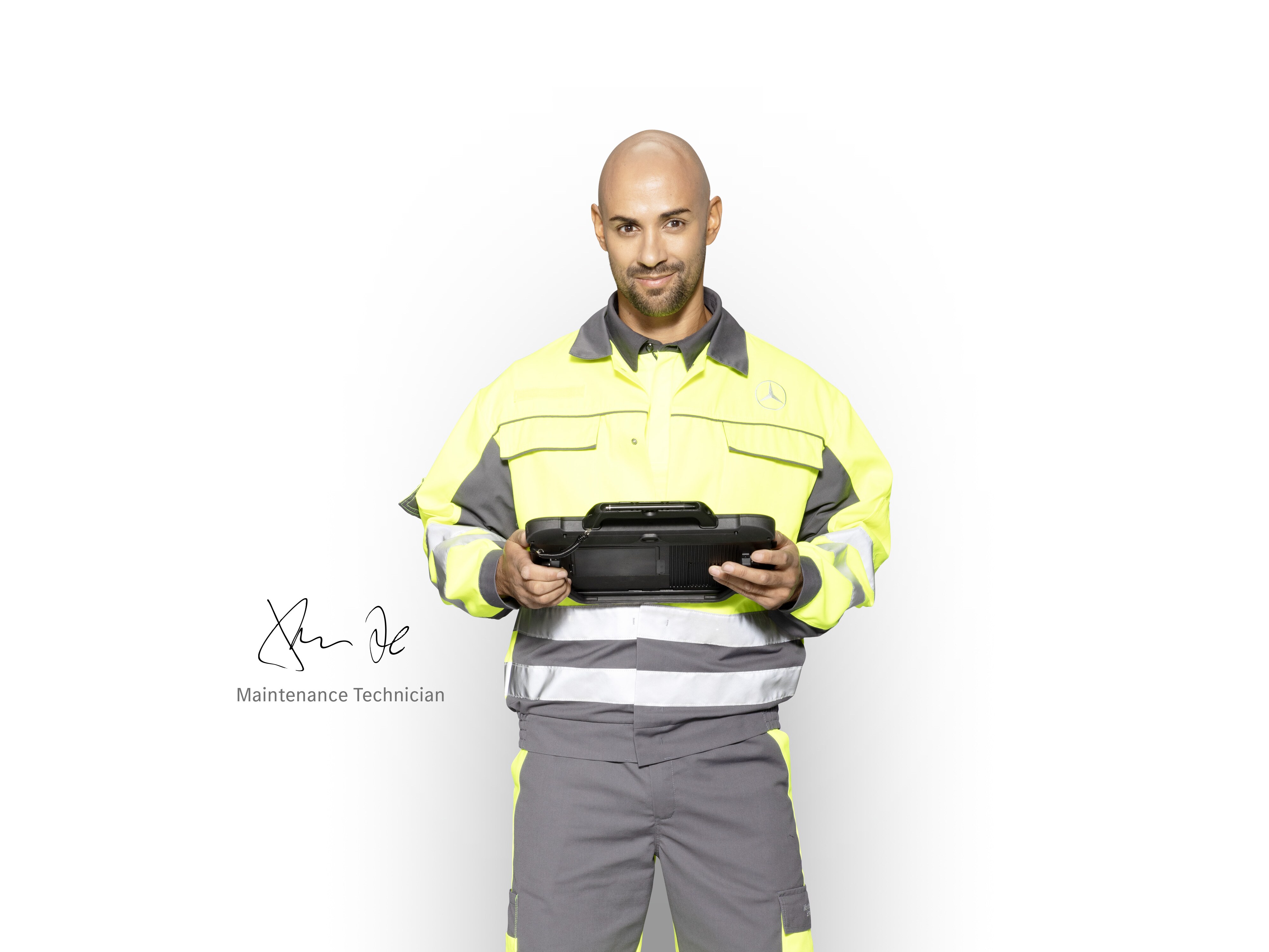 Mercedes-Benz Service Technician with a tablet, ready to check the mobility warranty services for your van
