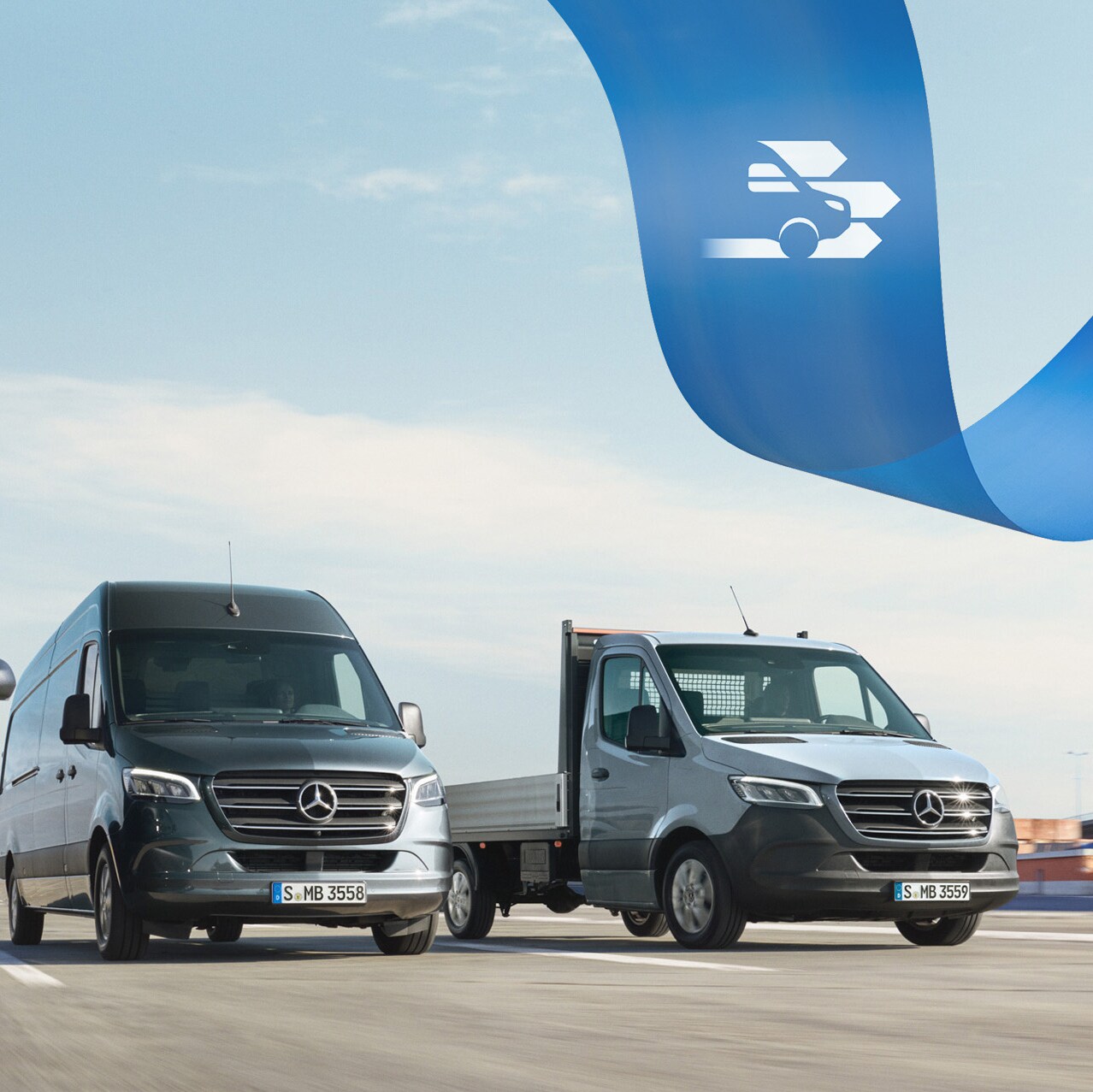 A range of Mercedes-Benz vans on the road with shipping containers in the background.