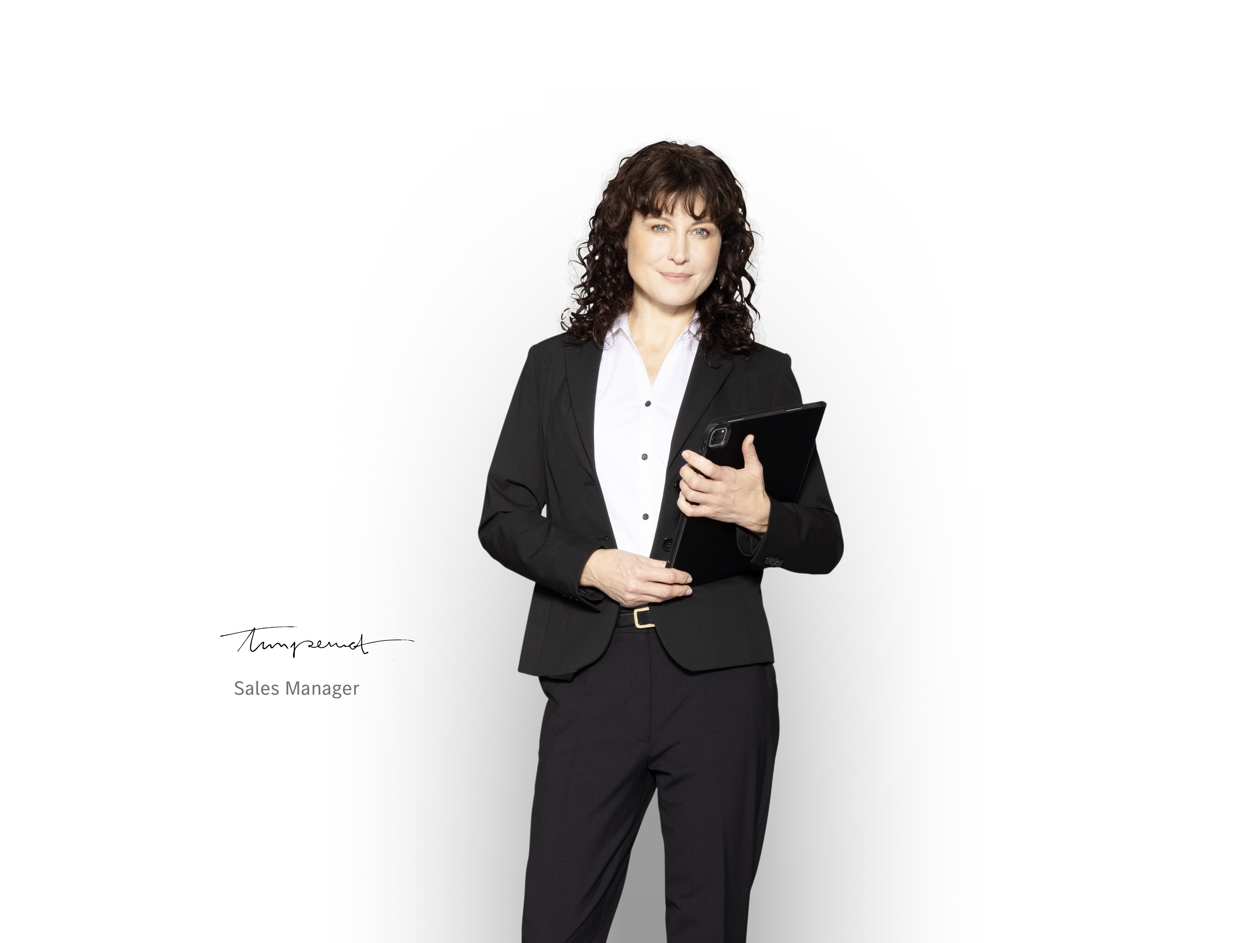 Mercedes-Benz Sales Manager with Tablet in her hands, ready to inform about new vehicle warranty.