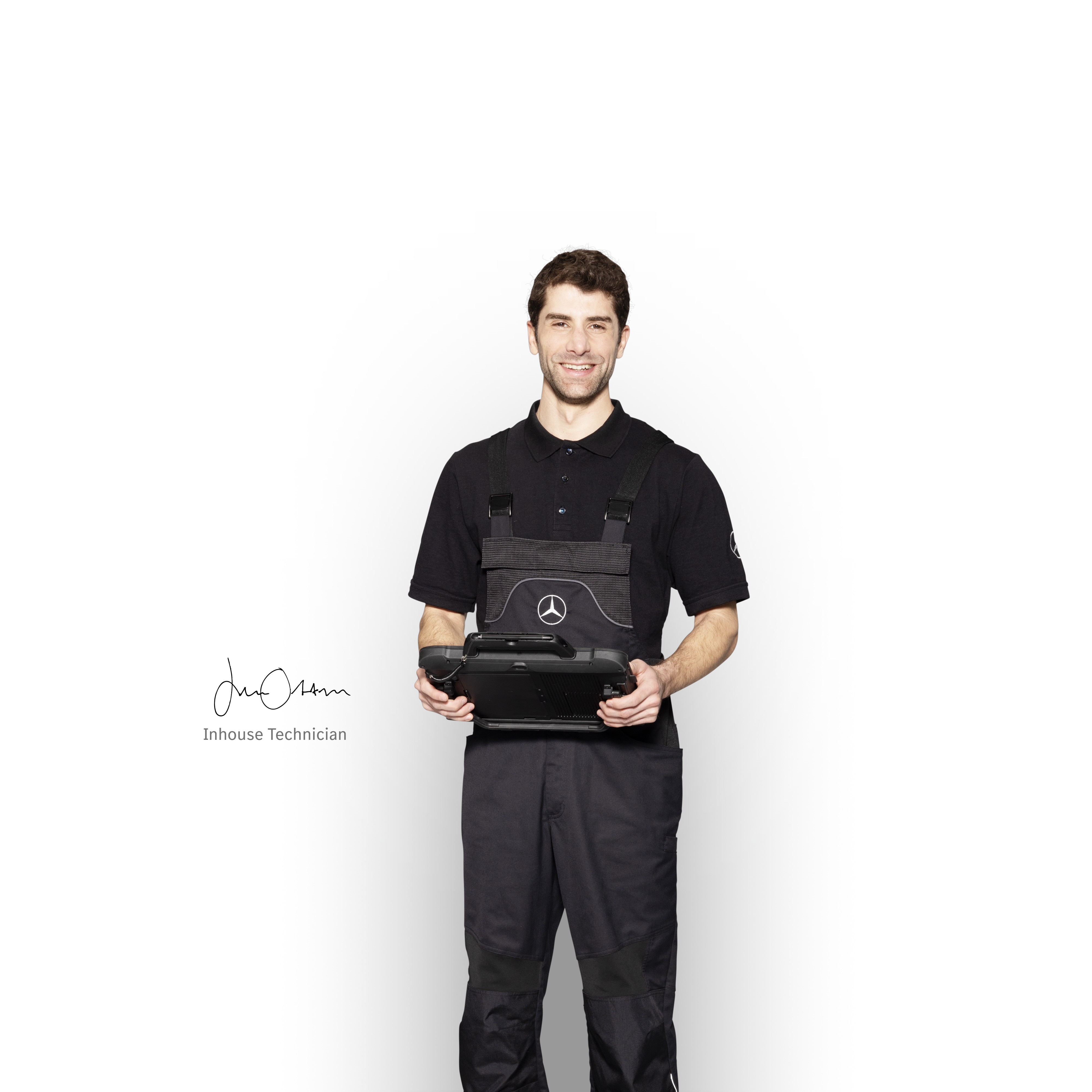 Mercedes-Benz | Vans Quality Engineering Inhouse Technician in workwear with tablet in his hands to ensure the best quality is delivered.