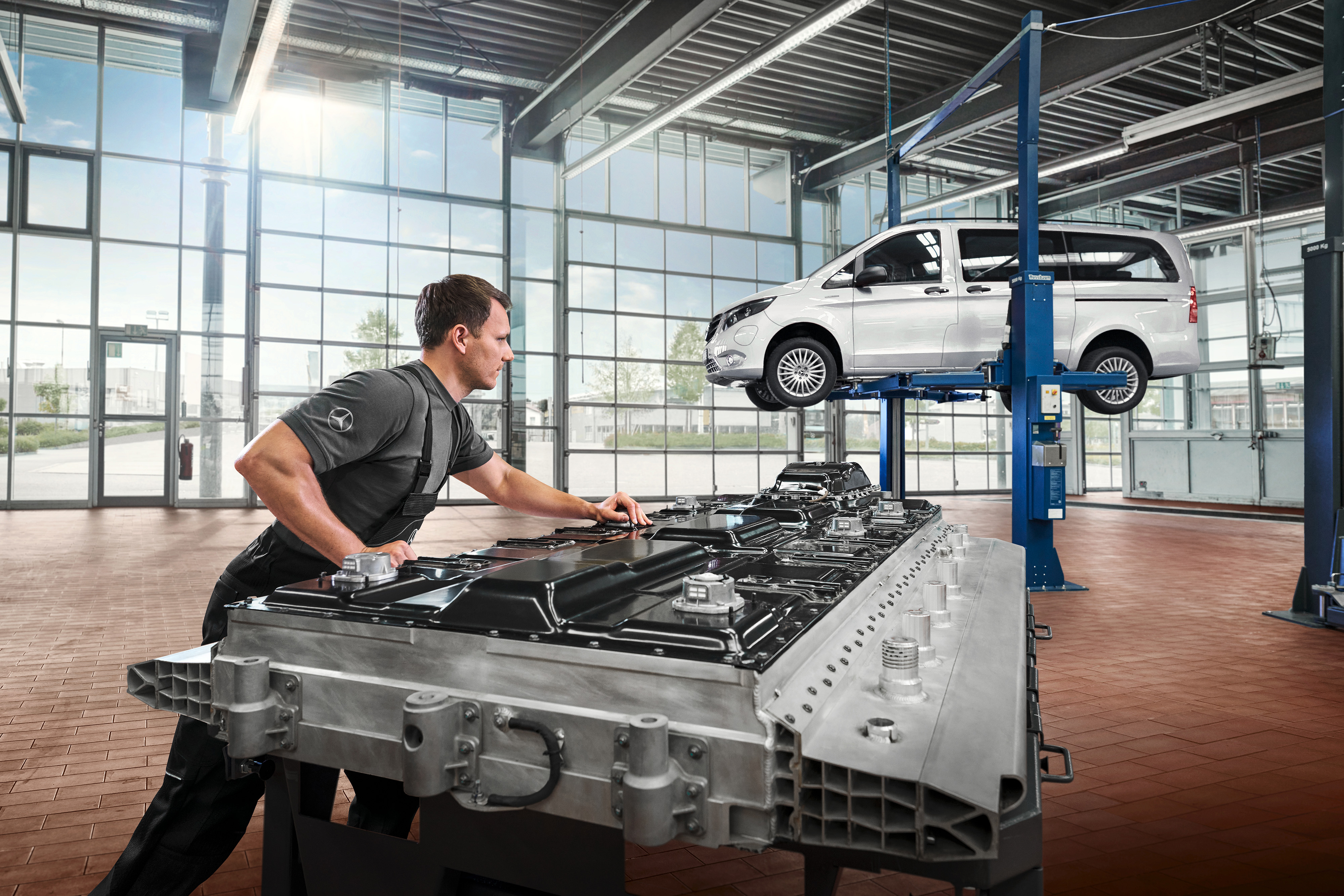 Mercedes-Benz | Electric Vehicle Service | Battery repair A technician checks battery modules in the workshop.