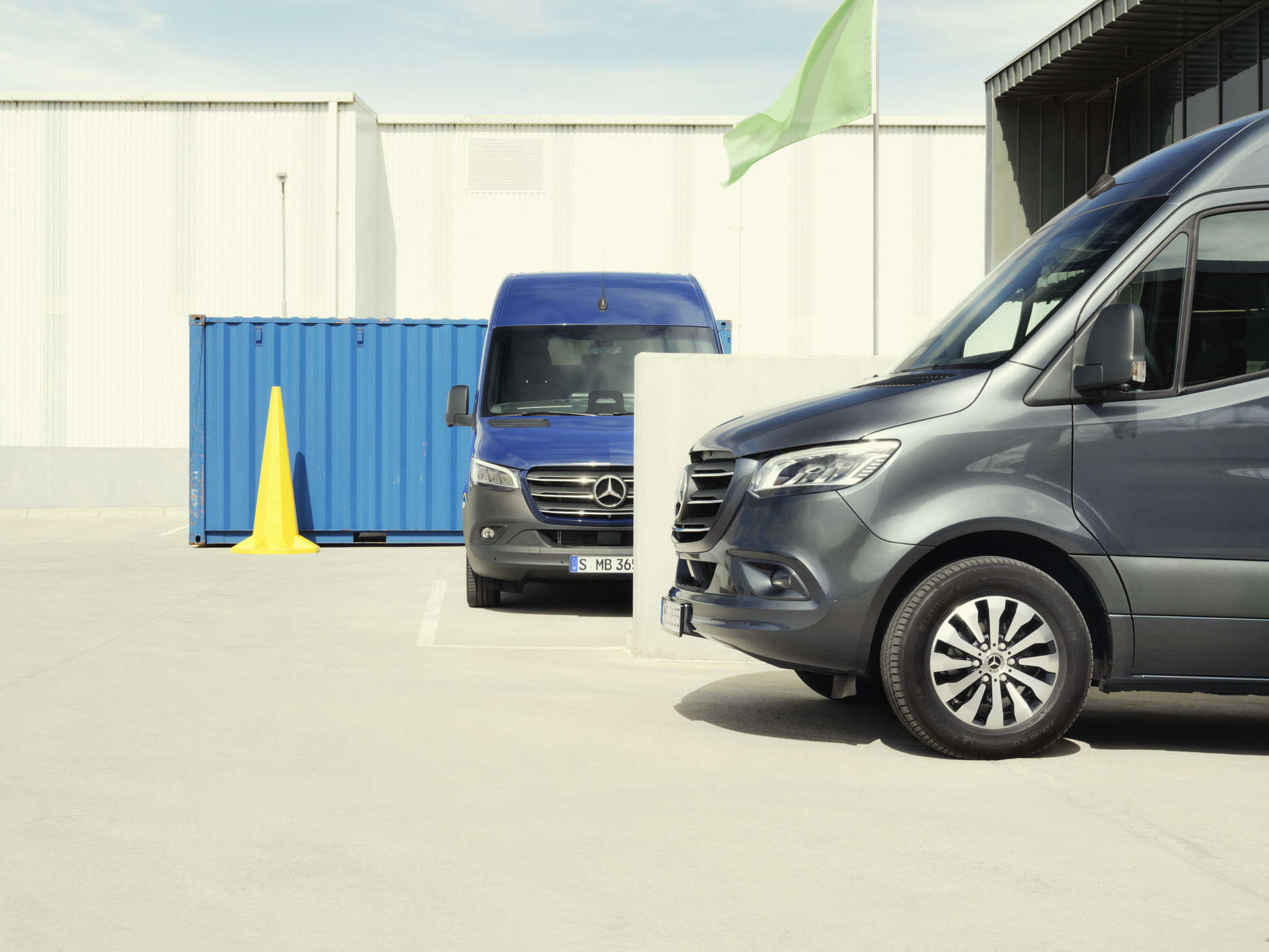Sprinter | Mercedes-Benz Two Sprinter models standing in a parking space.