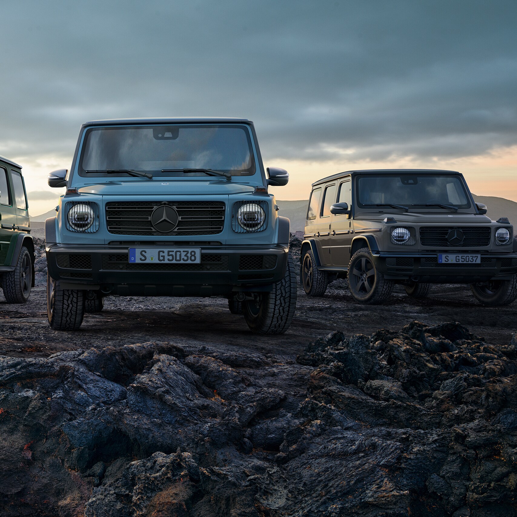 The Mercedes-Benz G-Class in a side front view in the mountains.