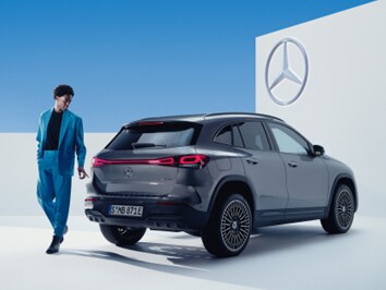 Mercedes-Benz business car driver next to EQA