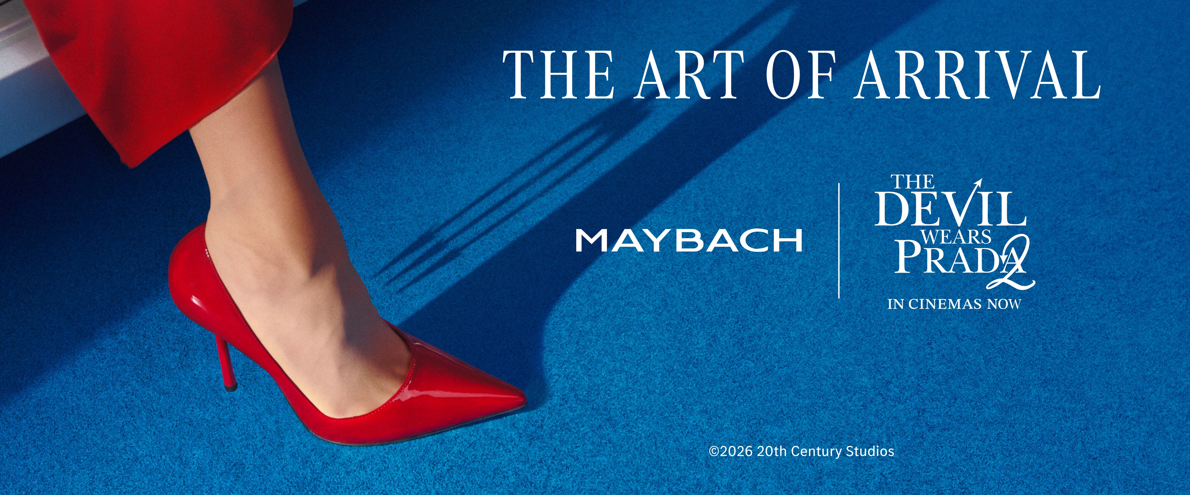 Woman in red heel stepping out of Mercedes Maybach onto blue carpet