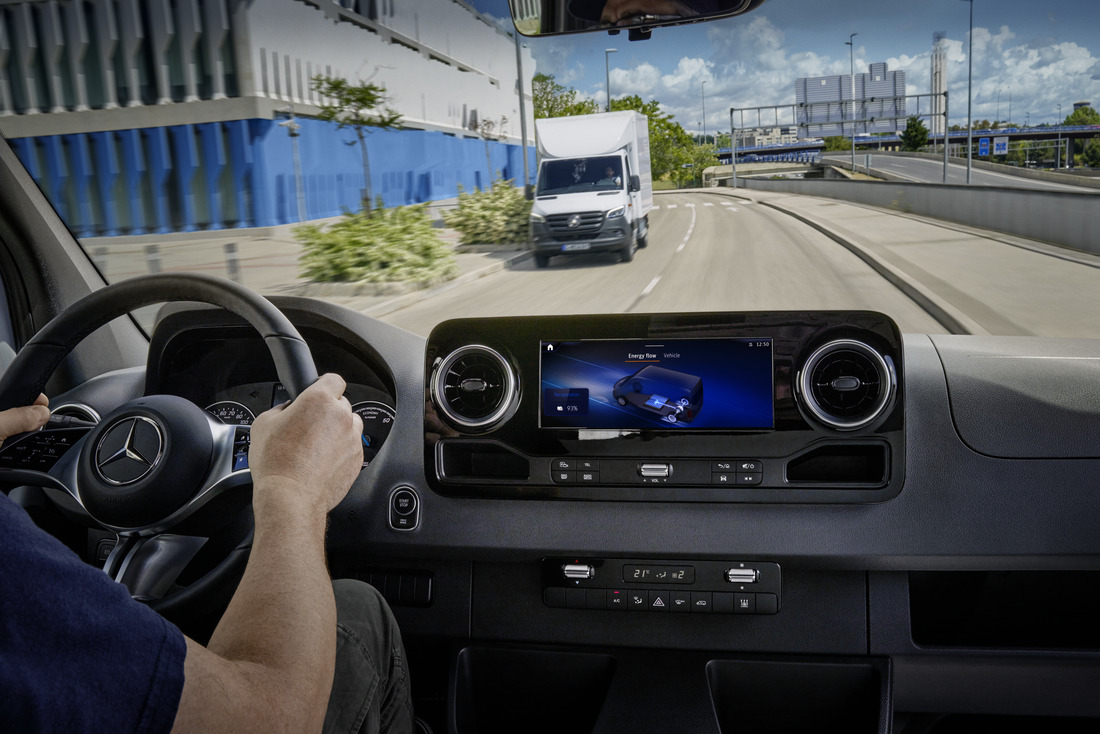 eSprinter Van Dashboard | Mercedes-Benz Vans eSprinter van dashboard with MBUX screen and oncoming van visible through the windshield.