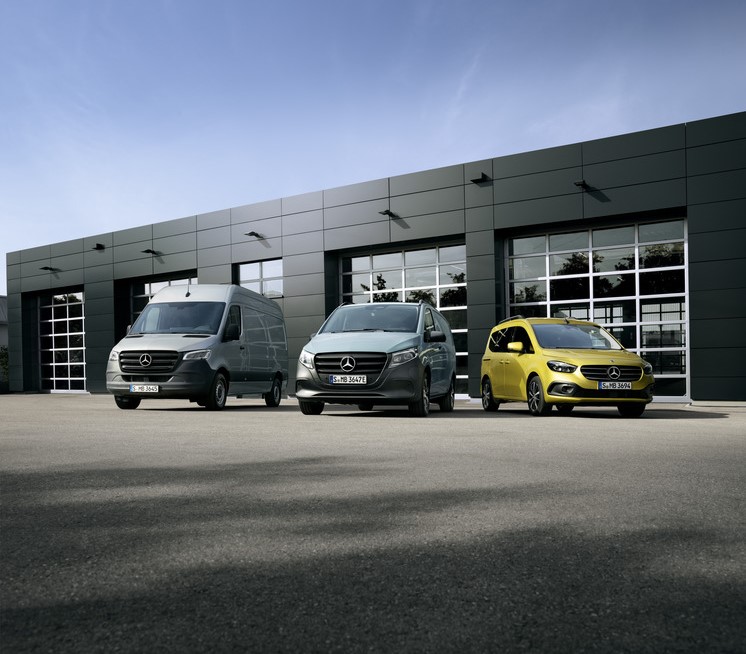 Three Mercedes-Benz vans parked outside a dealership | Mercedes-Benz Vans A grey Sprinter, a light grey Vito, and a yellow Citan parked in front of a modern building.