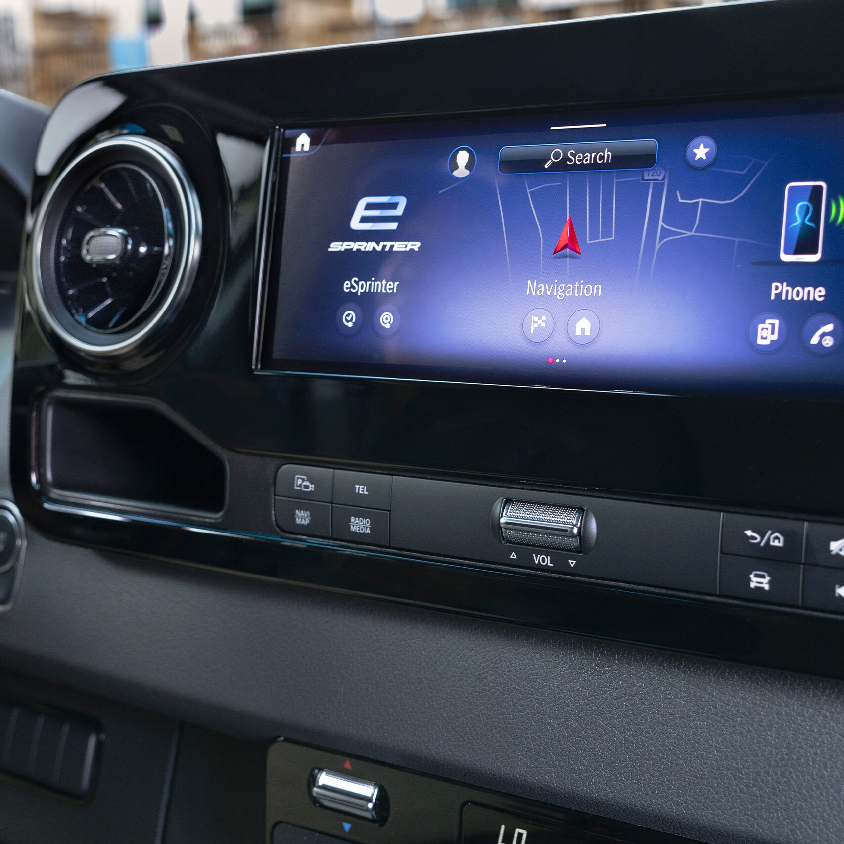 A close-up of the MBUX infotainment system in the Mercedes-Benz eSprinter van.