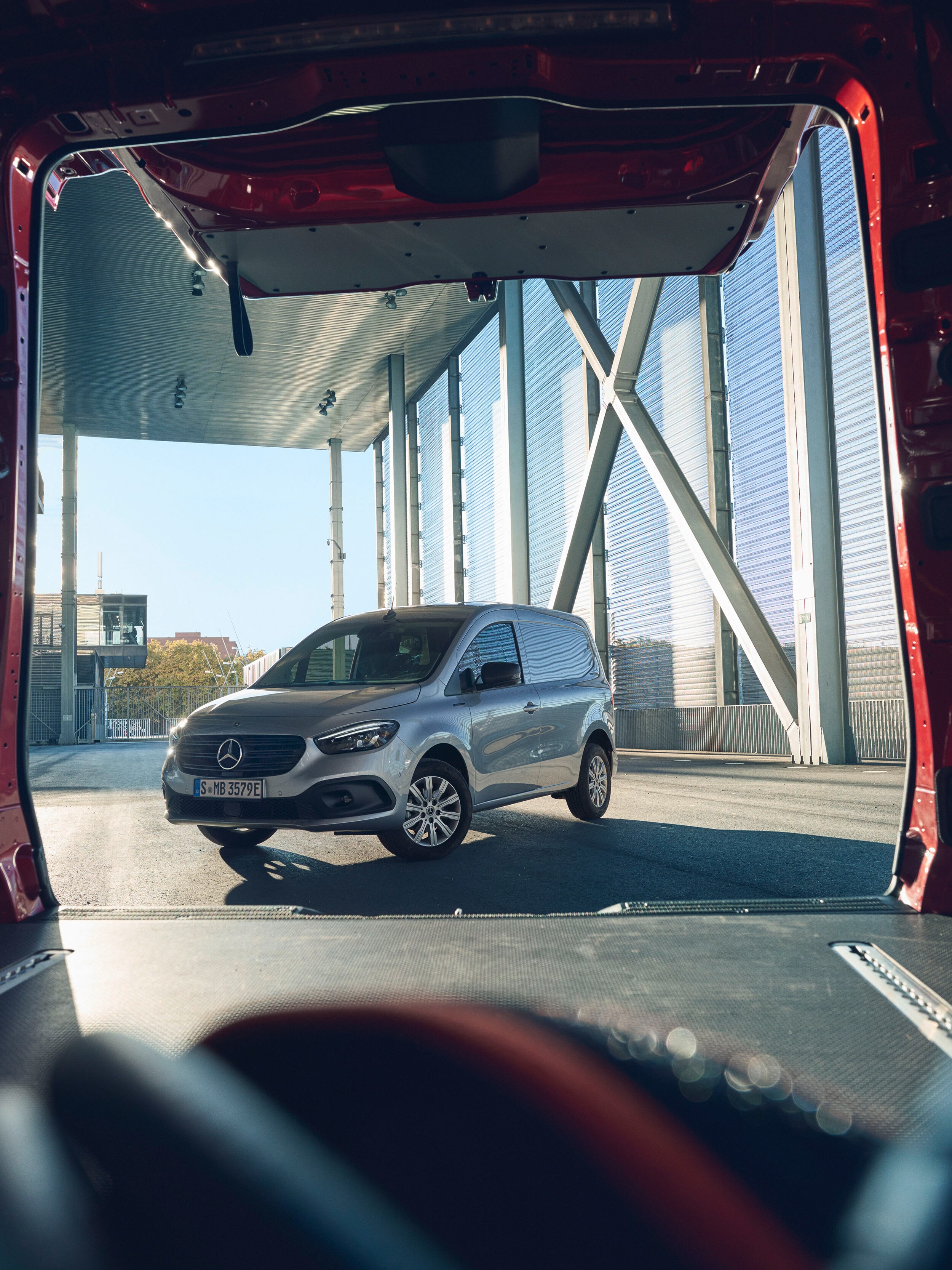 View of a Mercedes-Benz Citan van through the open rear of another Mercedes-Benz van.