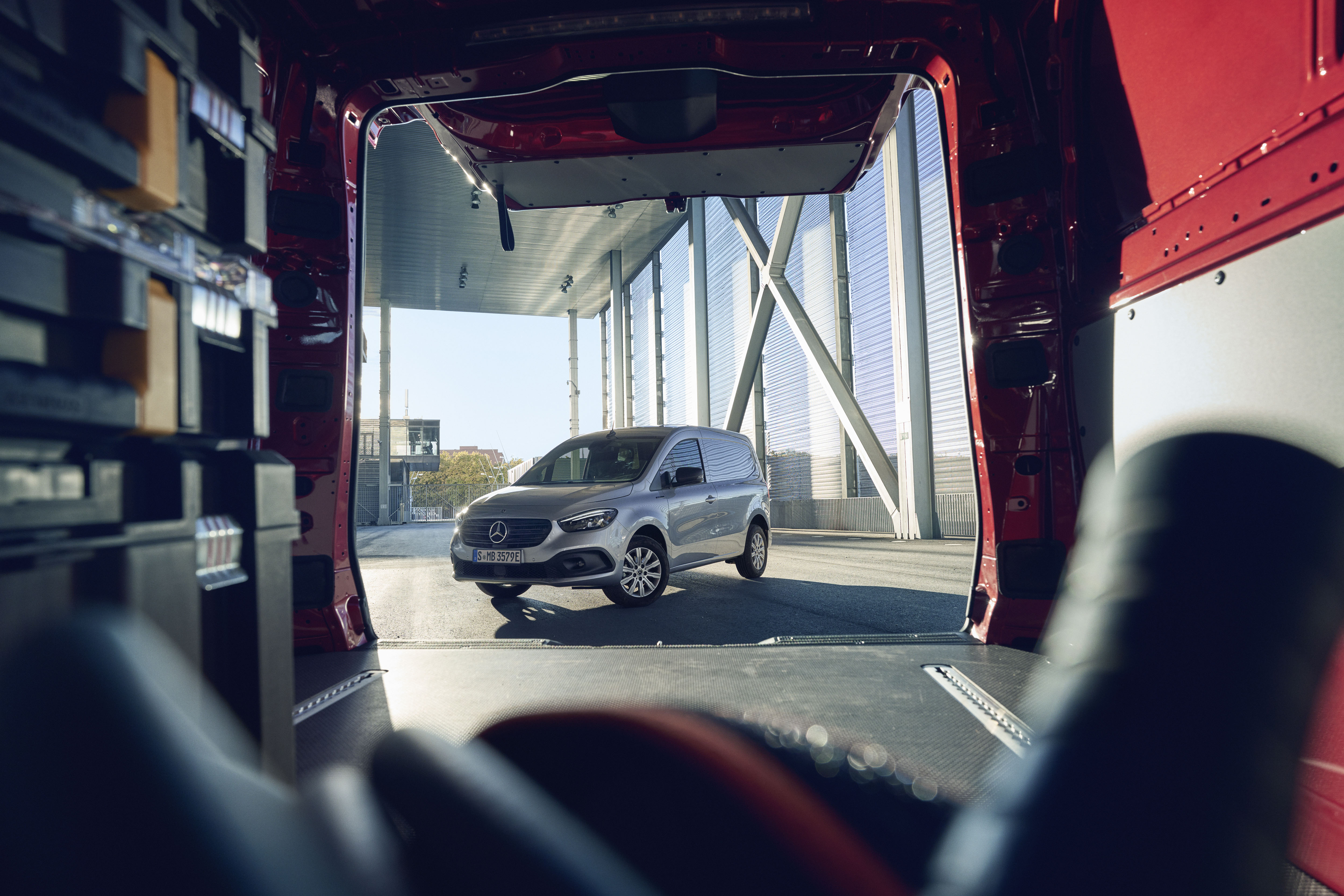 View of Citan Van Through Another Van | Mercedes-Benz Vans View of a Mercedes-Benz Citan van through the open rear of another Mercedes-Benz van.