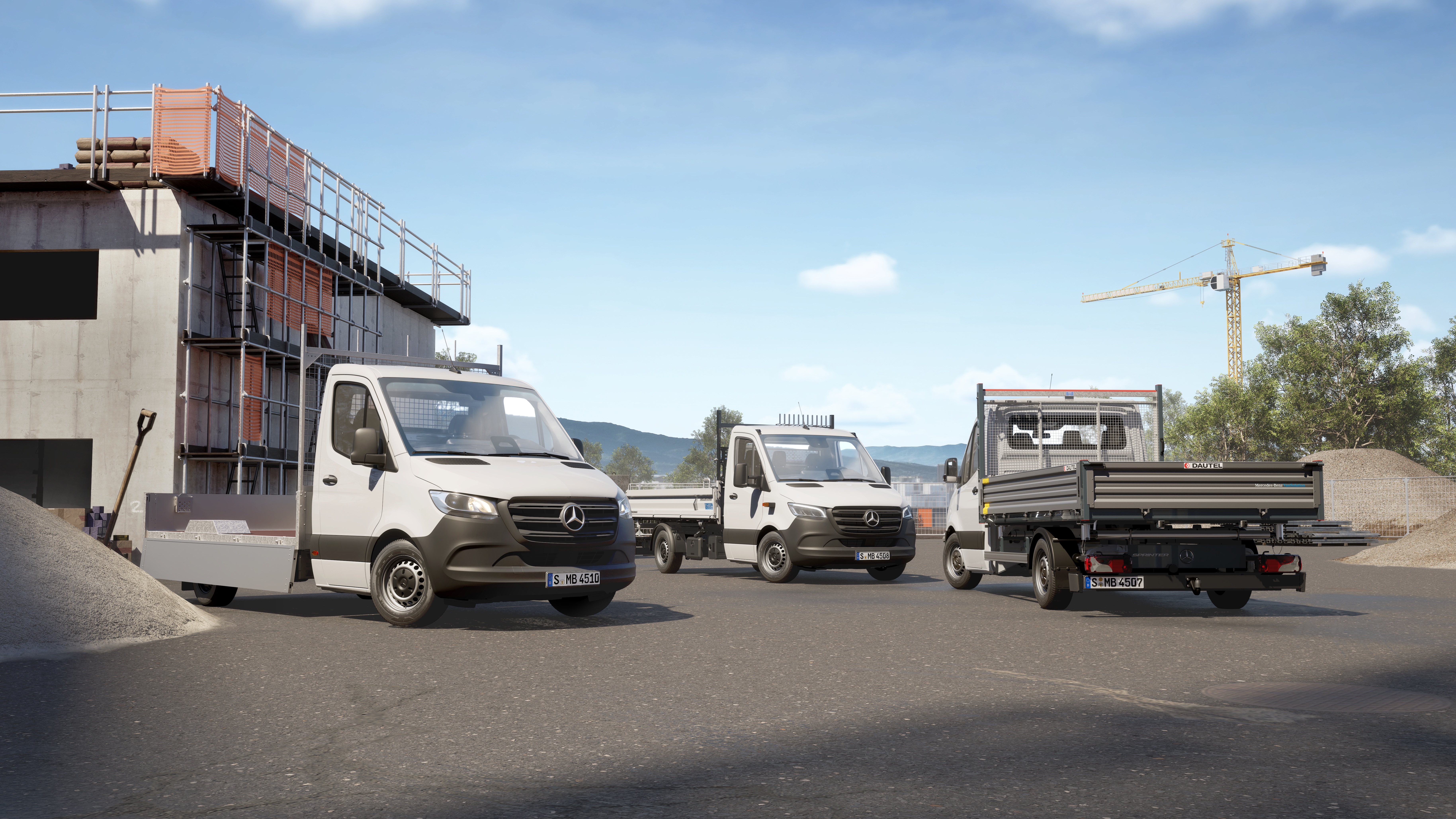 Two Chassis Cab Vans | Mercedes-Benz Vans Two white Mercedes-Benz chassis cab vans with tipper and flatbed bodies parked on a construction site.