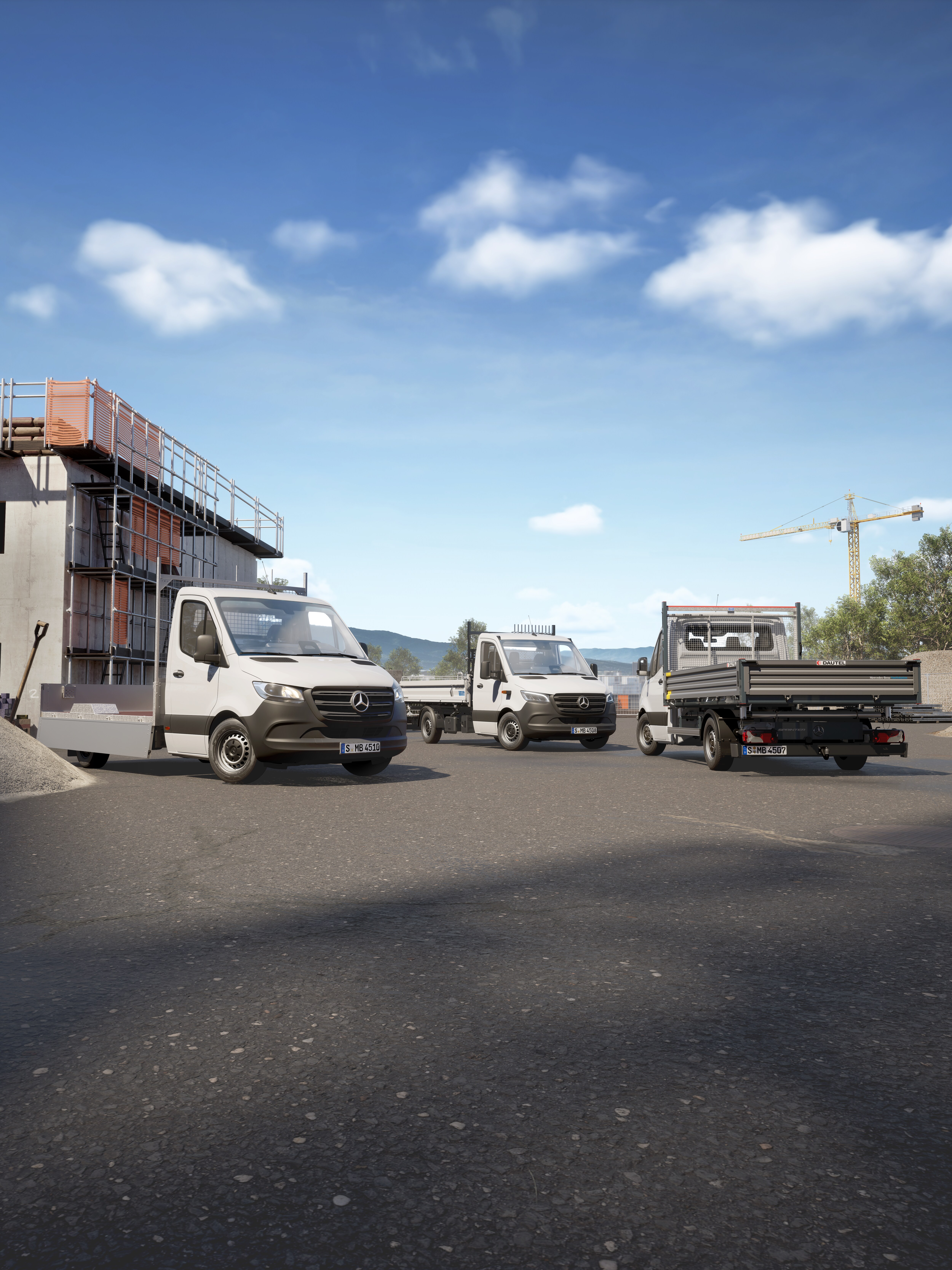 Three white Mercedes-Benz chassis cab vans with tipper and flatbed bodies parked on a construction site.