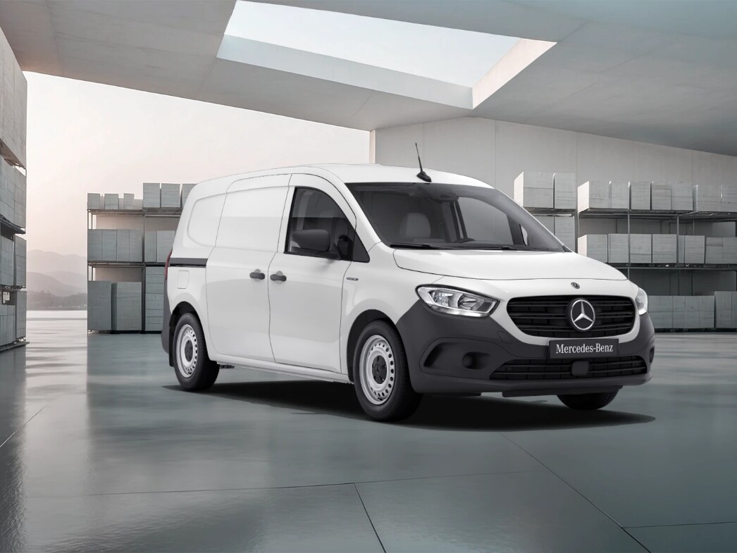White Mercedes-Benz eCitan Panel Van parked in a bright industrial warehouse.