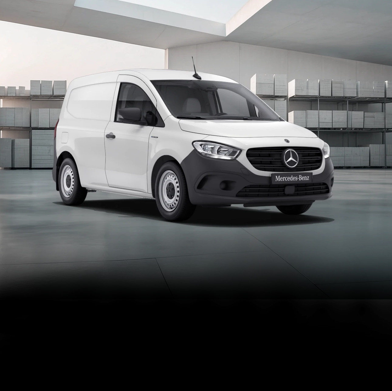 Birdseye view of three Mercedes-Benz panel vans – a grey Citan, a white Vito and a dark Blue Sprinter – under a bridge in an urban setting.