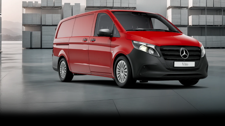 White Mercedes-Benz Vito Panel Van parked by modern concrete structure.