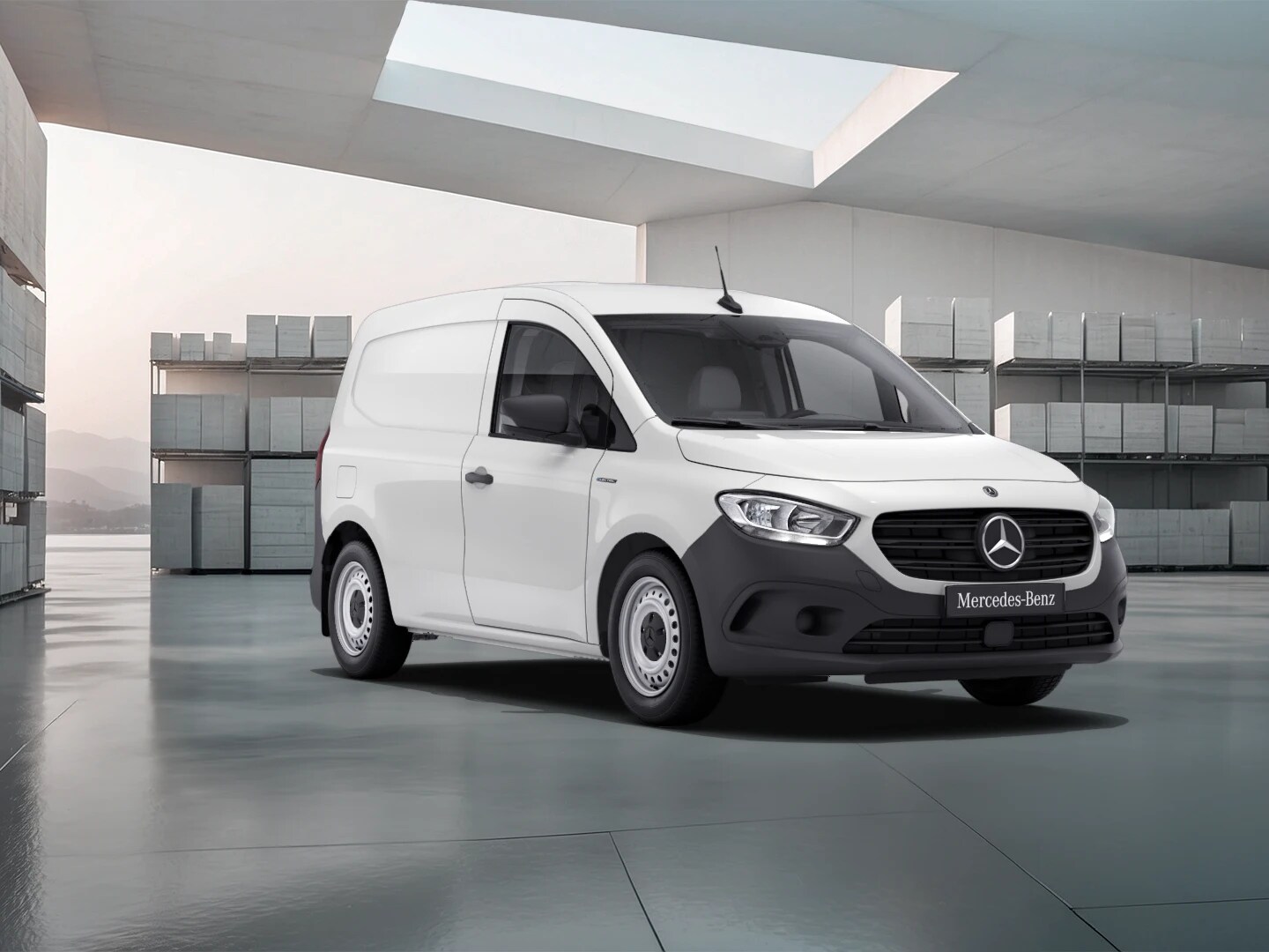 White Mercedes-Benz eCitan Panel Van parked by modern concrete structure.