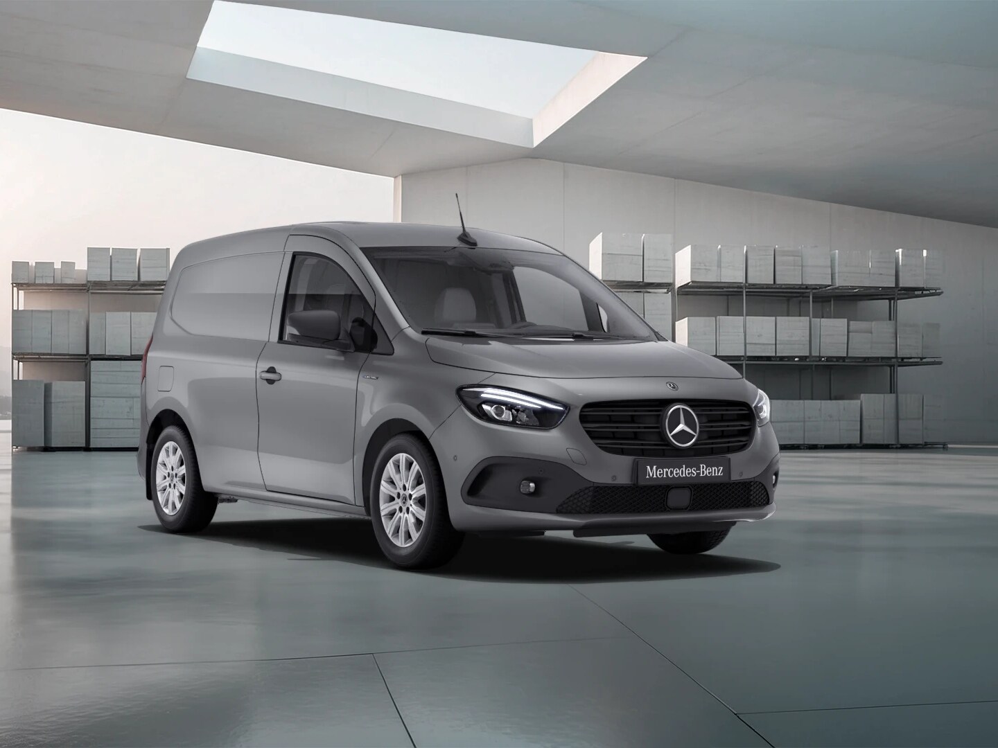 Mercedes-Benz eCitan, eVito and eSprinter electric vans parked in front of a battery charging graphic.