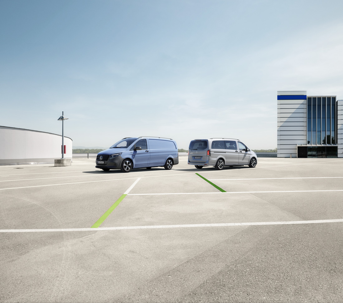 The eVito Panel Van standing in a parking space next to a charging station. Charging | eVito Panel Van | Mercedes-Benz