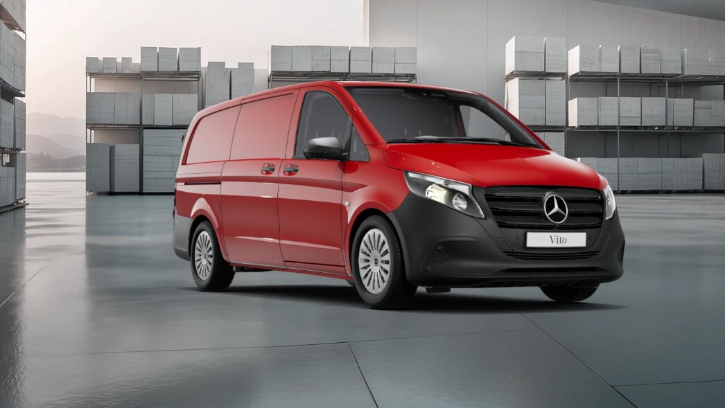 White Mercedes-Benz Vito Panel Van parked by modern concrete structure.