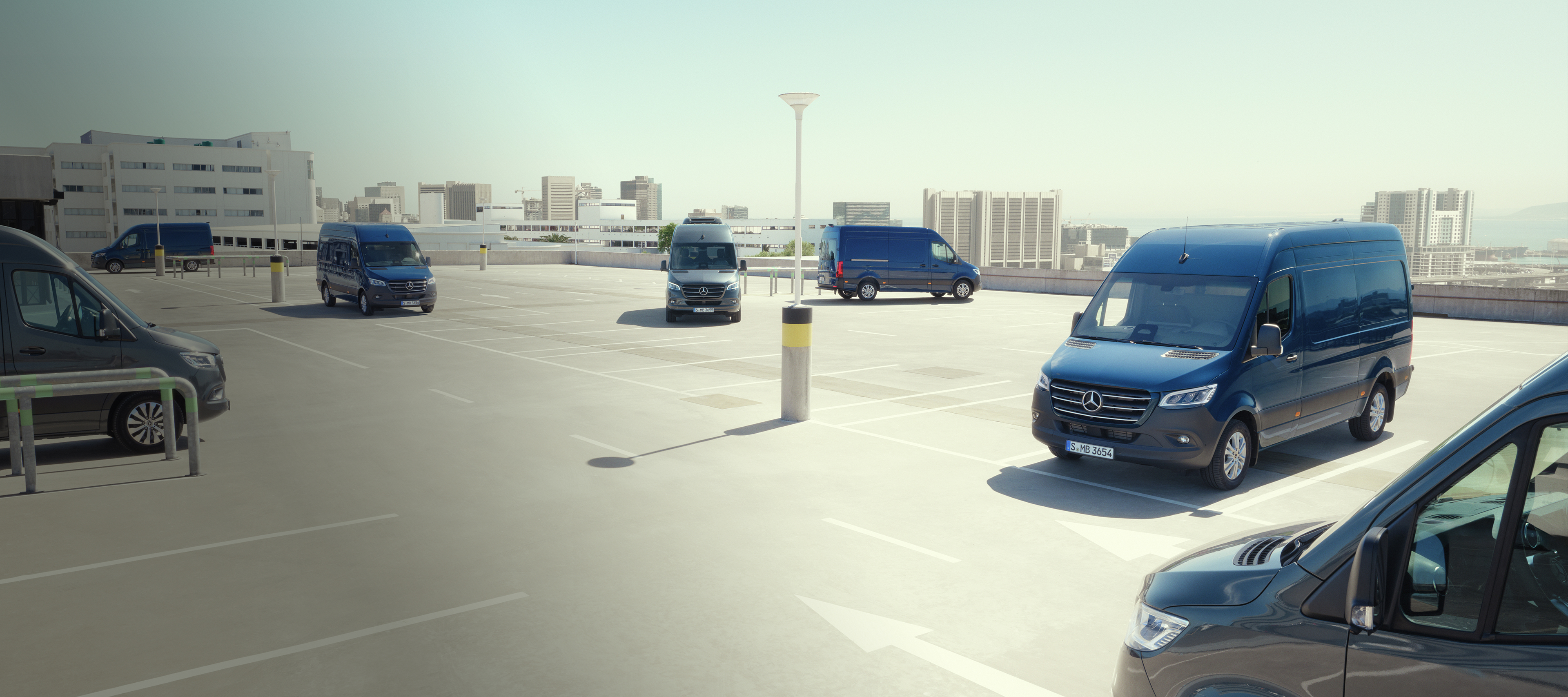 Sprinter Range | All Sprinter | Mercedes-Benz Vans Mercedes‑Benz van Sprinter Range lineup in an urban setting, futuristic