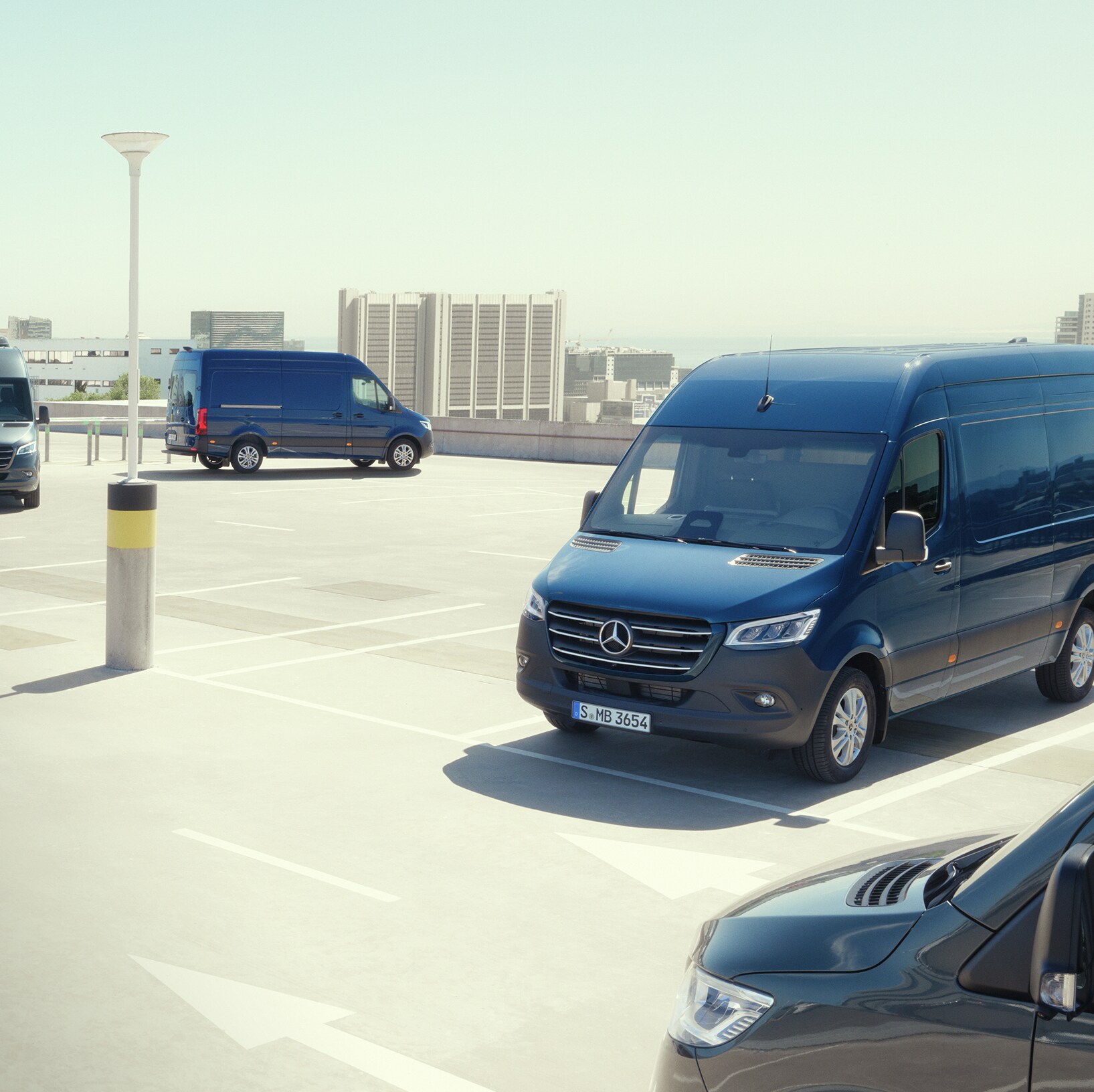 Mercedes‑Benz van Sprinter Range lineup in an urban setting, futuristic