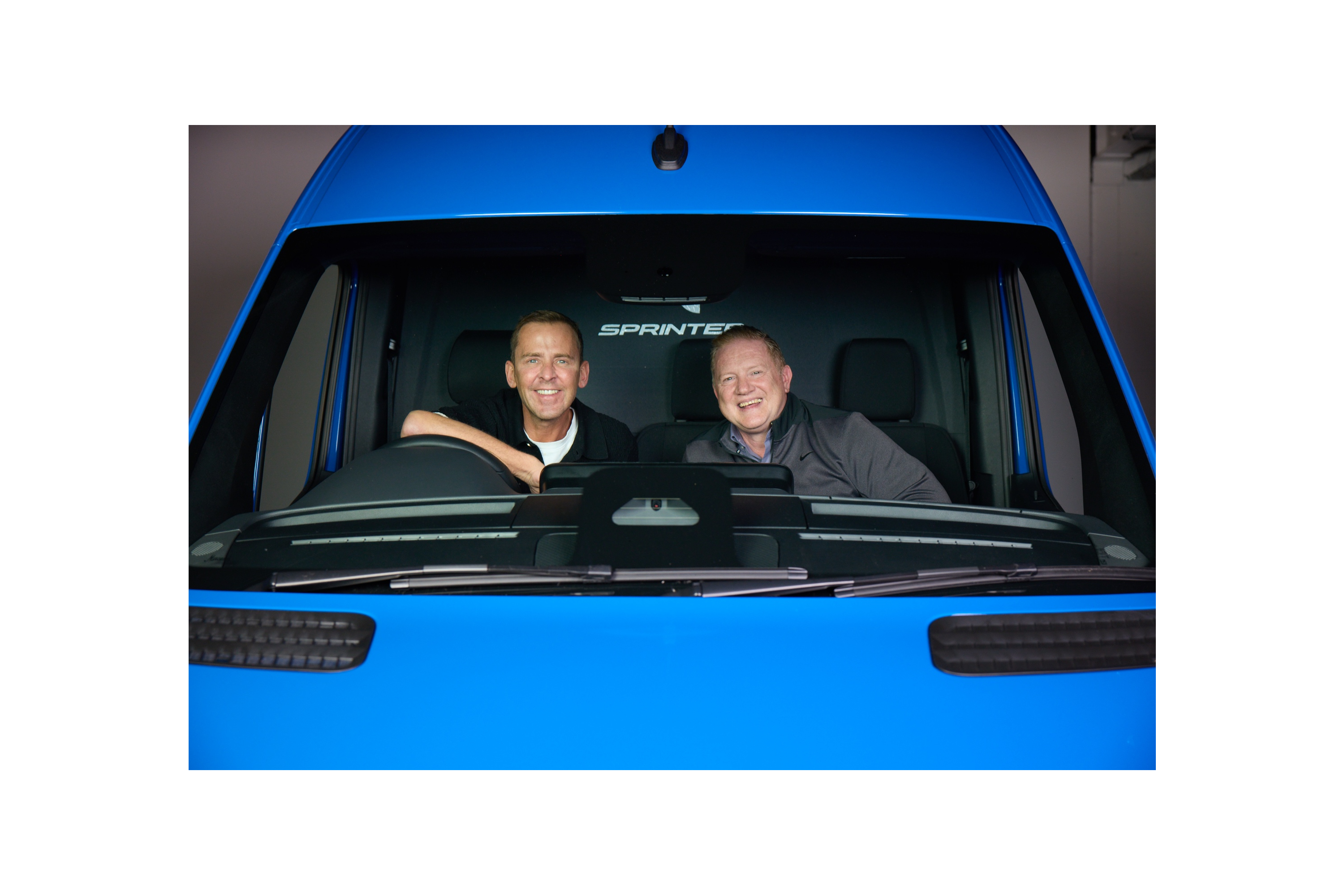 Neil Miller in a blue Sprinter Van Neil Miller in a blue Sprinter Van
