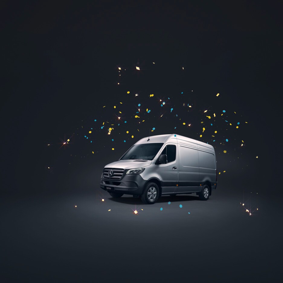 Grey Mercedes-Benz Sprinter on a black background, surrounded by confetti.
