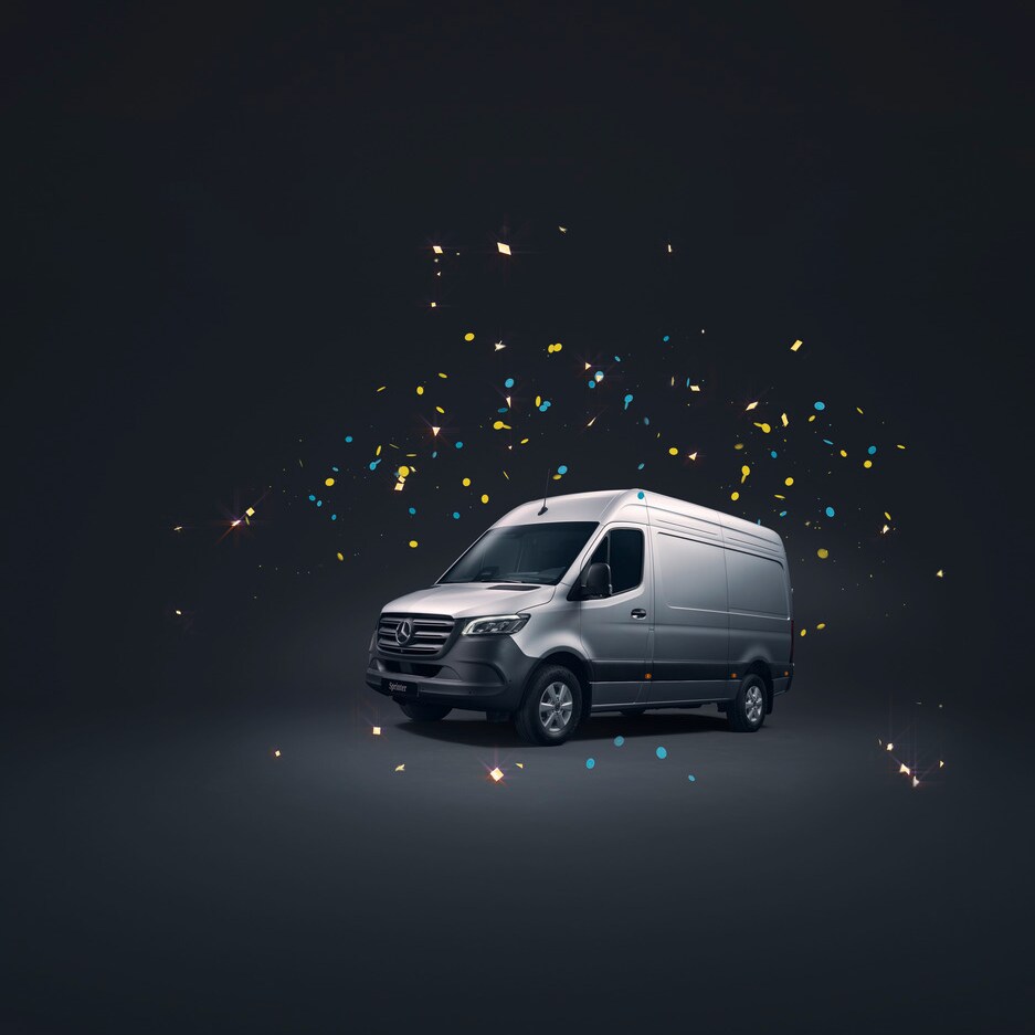Grey Mercedes-Benz Sprinter on a black background, surrounded by confetti.