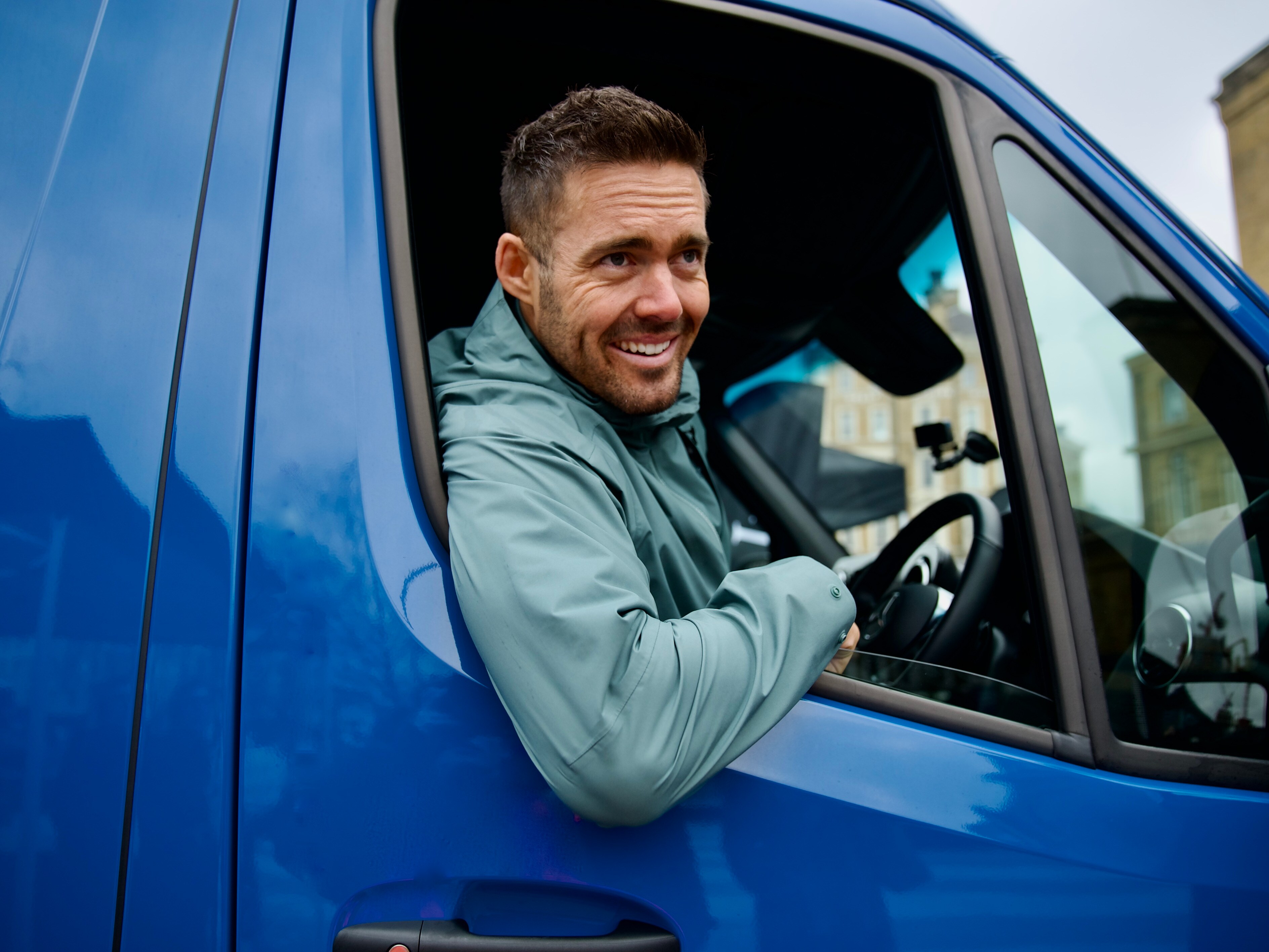 Spencer Matthews in a blue Sprinter Panel van.